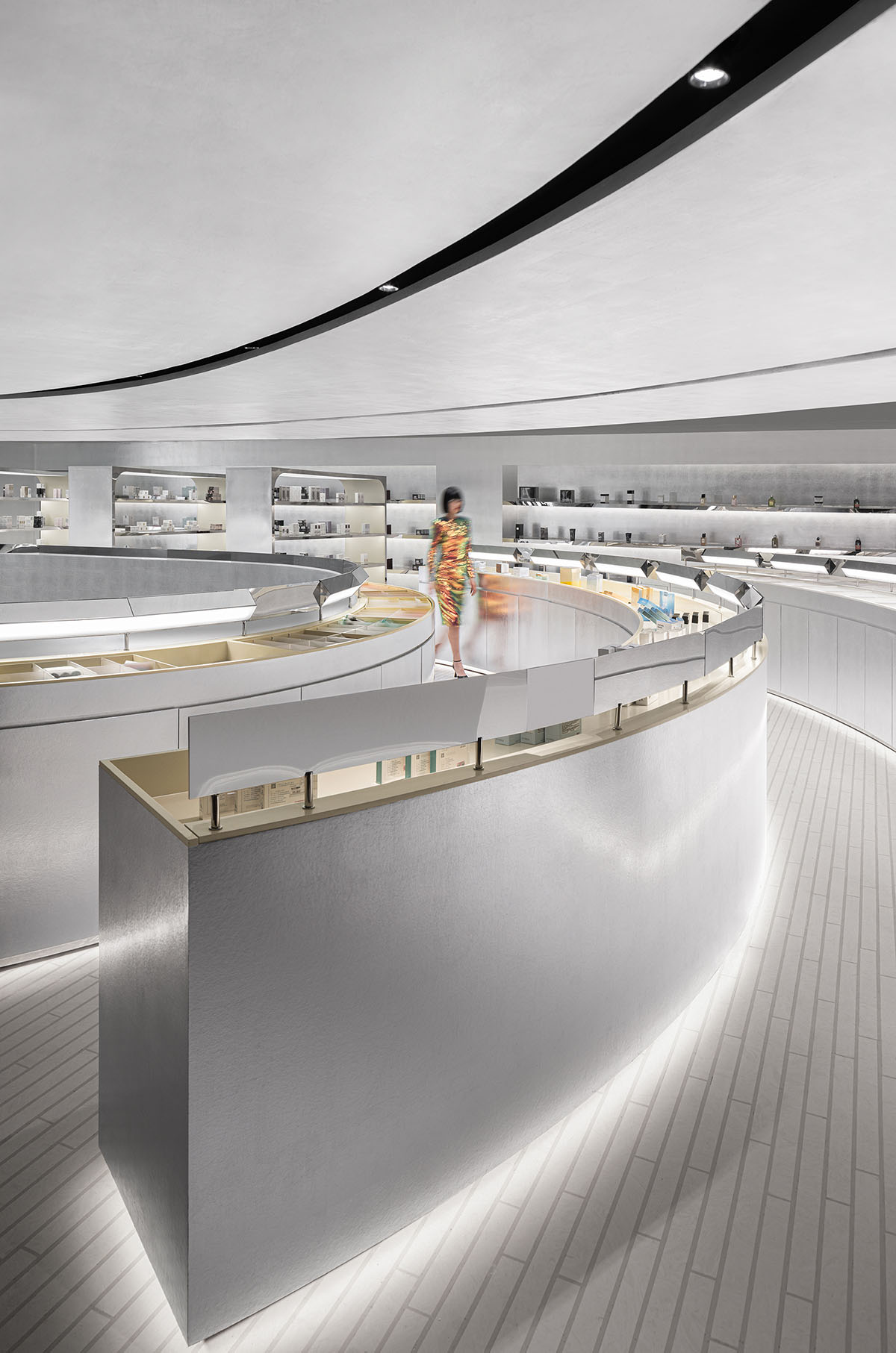 Various Associates designs beauty store with winding staircase and silver-toned interiors in Hangzhou