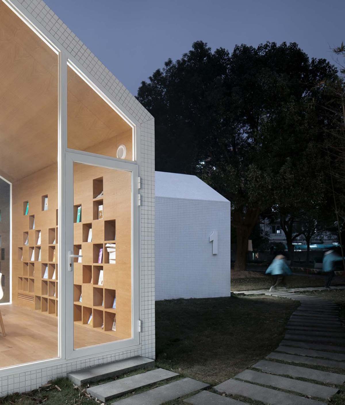 Four mini cabins by Yuan Architects scattered in a forest to create a  reading village in