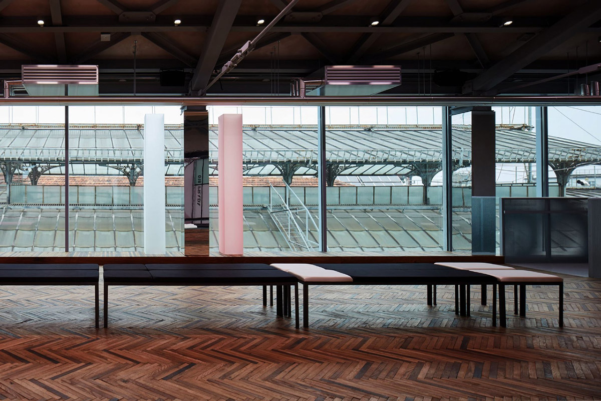AMO filled Prada 2018 Resort stage with pink columns, continuous mirrors and disoriented seatings