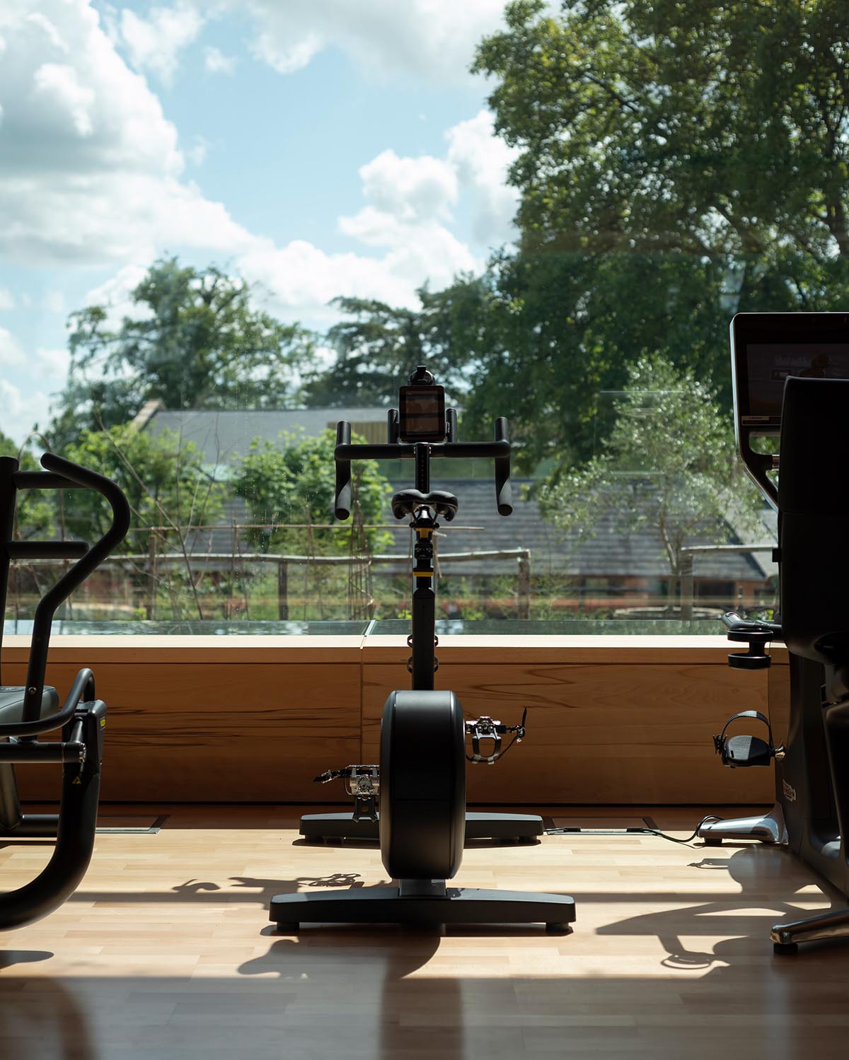 Invisible Studio creates large window for a gymnasium overlooking to a productive garden in Somerset