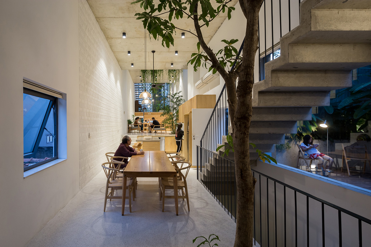 ODDO architects built this narrow house with rich interior spaces and perforated skin in Hanoi