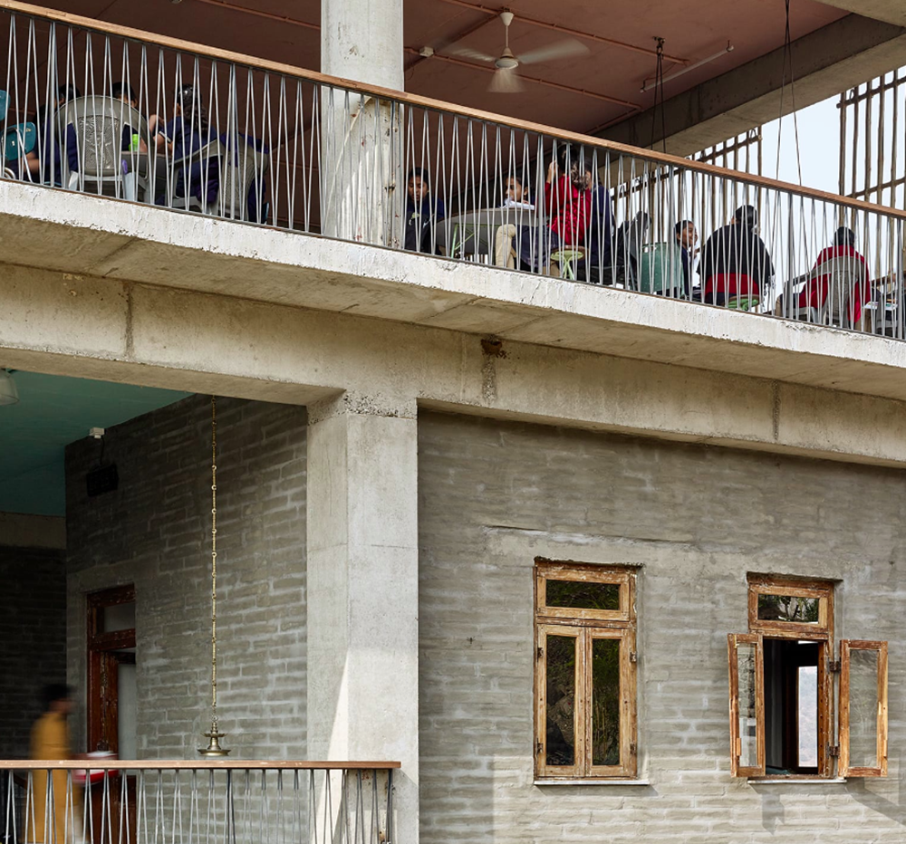 Avasara Academy, resembling an unfinished structure, educates young women in the moorland of Pune