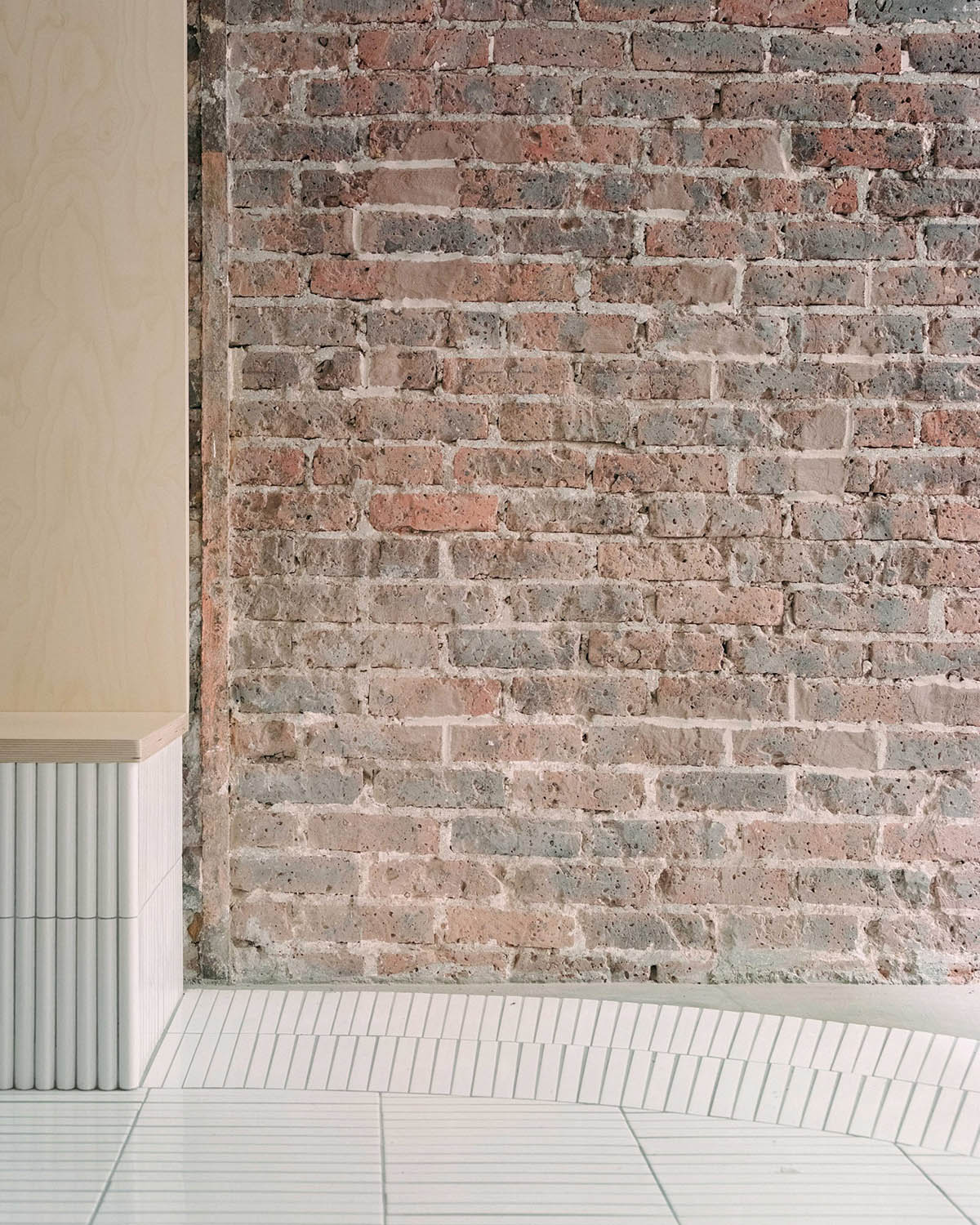 Neri&Hu-designed restaurant in Paris exposes layering material history with oblong volume inside