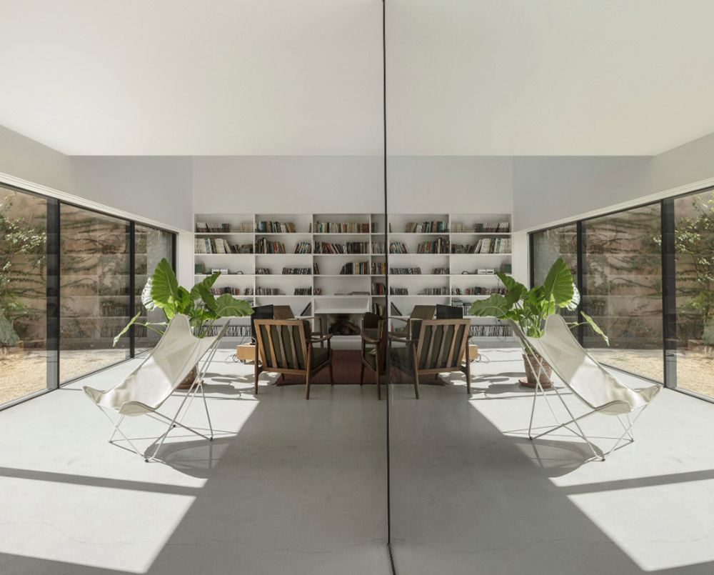 Extrastudio converted former winery in Portugal  into a new family home with red mortar walls