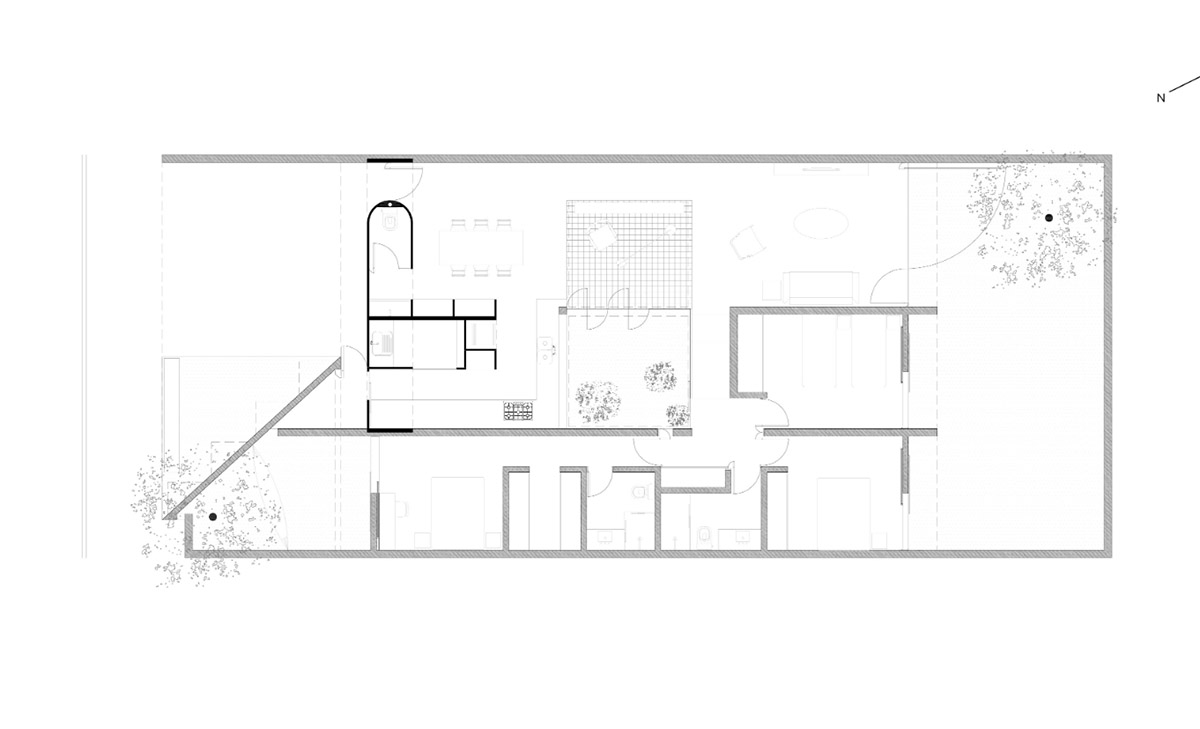 V&atilde;o designed recessed volumes and leaning red wall to offer flexible spaces for this Brazilian house