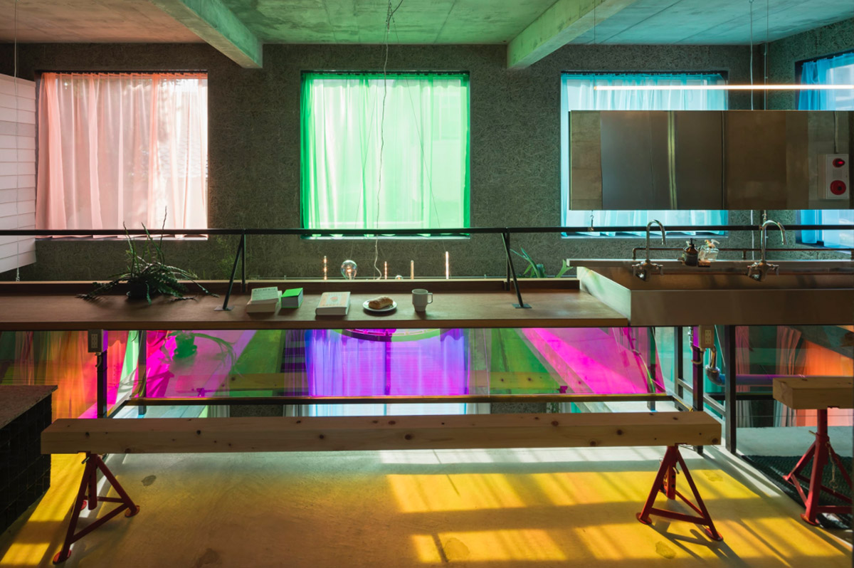Tato Architects creates painted effect to this concrete hotel by using colourful curtains in Osaka