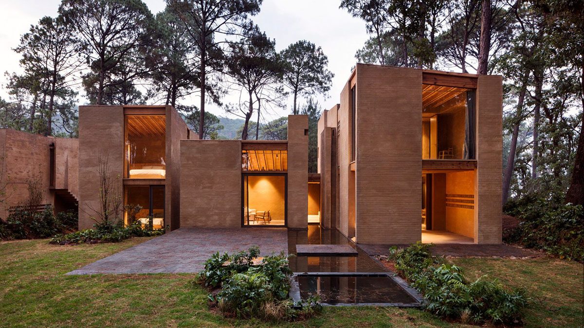 Taller Hector Barroso built five weekend houses from red-coloured terra-cotta in Mexican forest