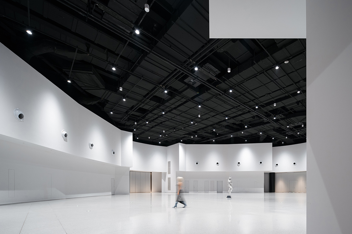 Undulating lines and expansive waves define interior of Orbit public exhibition hall in Shanghai 
