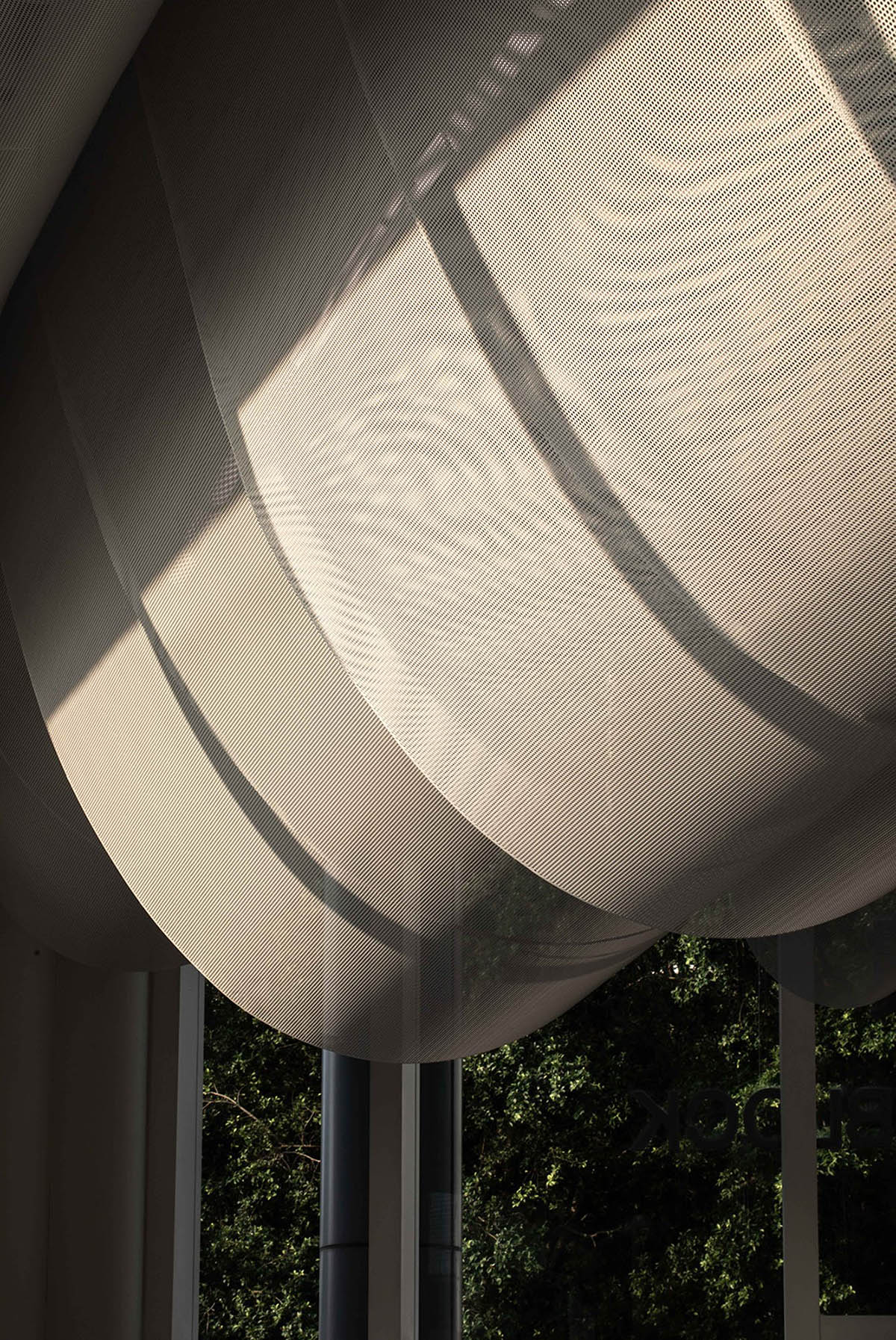 Atelier Nuno Architects suspends tubular aluminum panels from the ceiling of a lobby in Hong Kong