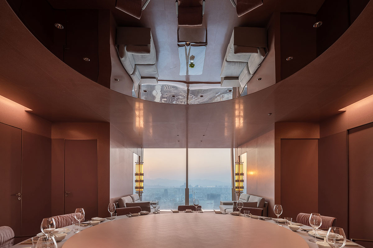 Nature Times Art Design completes restaurant with cave-like wall and garden-themed hall in Hangzhou