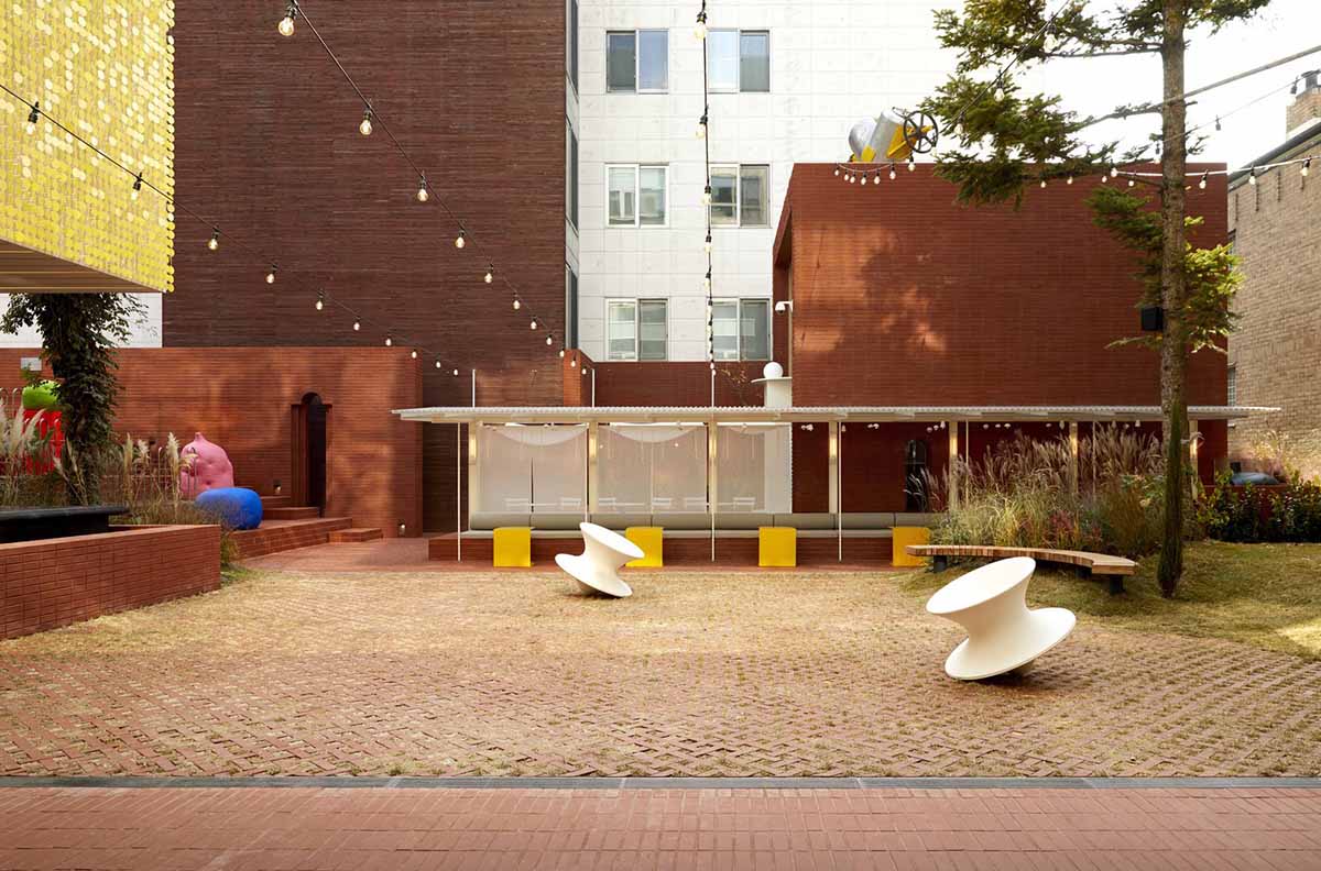 Roly-Poly Cotto restaurant fills in between historic buildings with its cave-like red brick facade