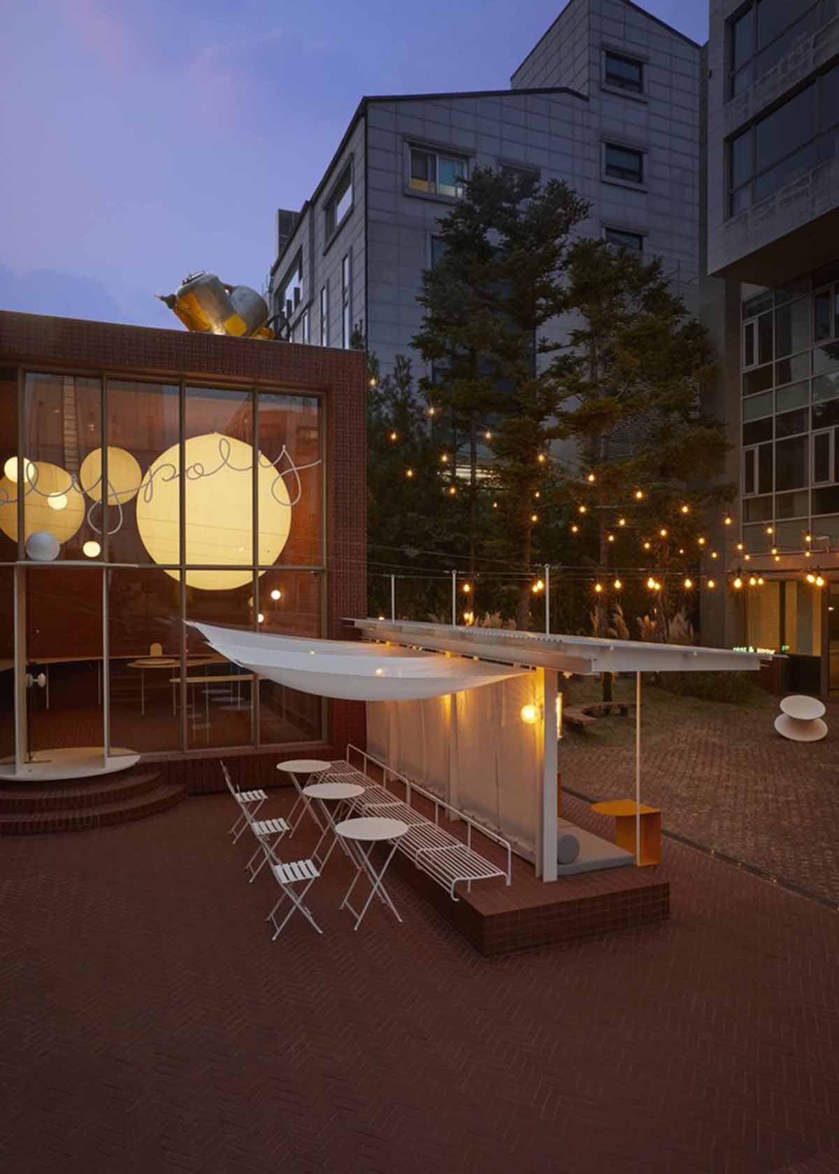 Roly-Poly Cotto restaurant fills in between historic buildings with its cave-like red brick facade