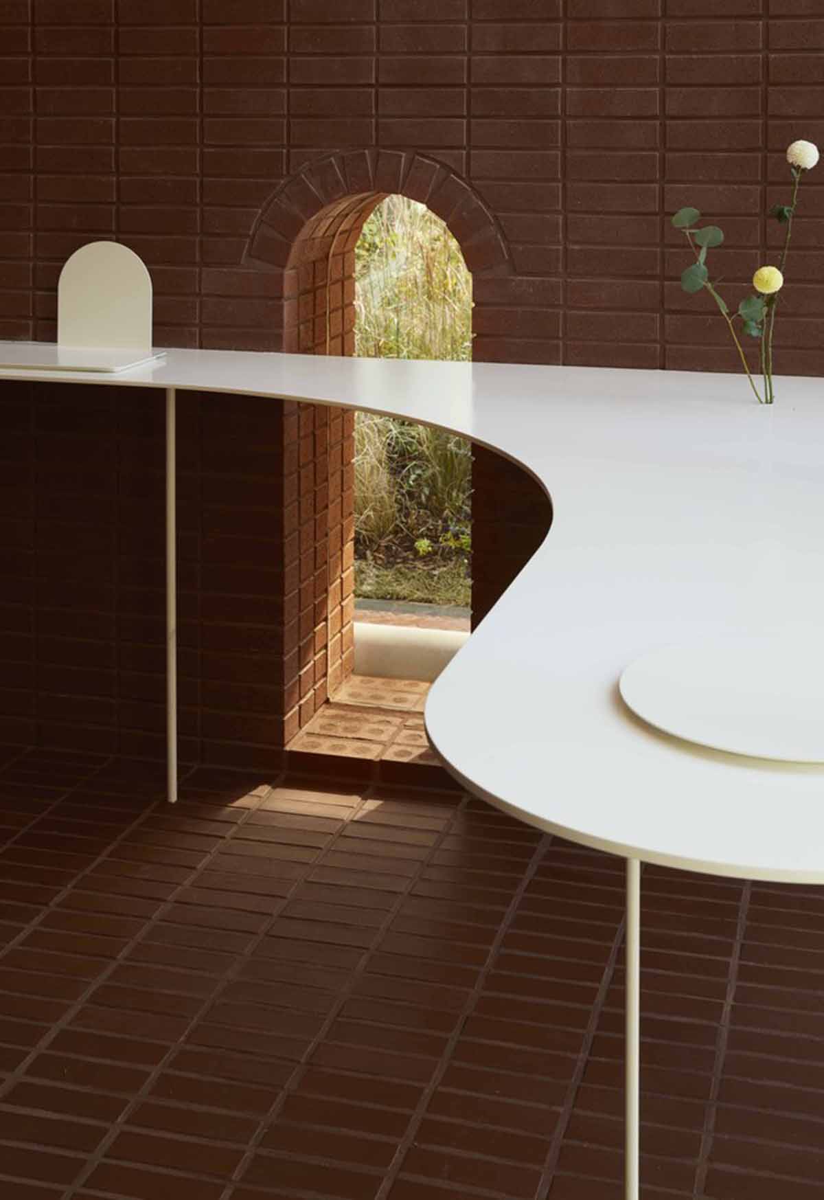 Roly-Poly Cotto restaurant fills in between historic buildings with its cave-like red brick facade