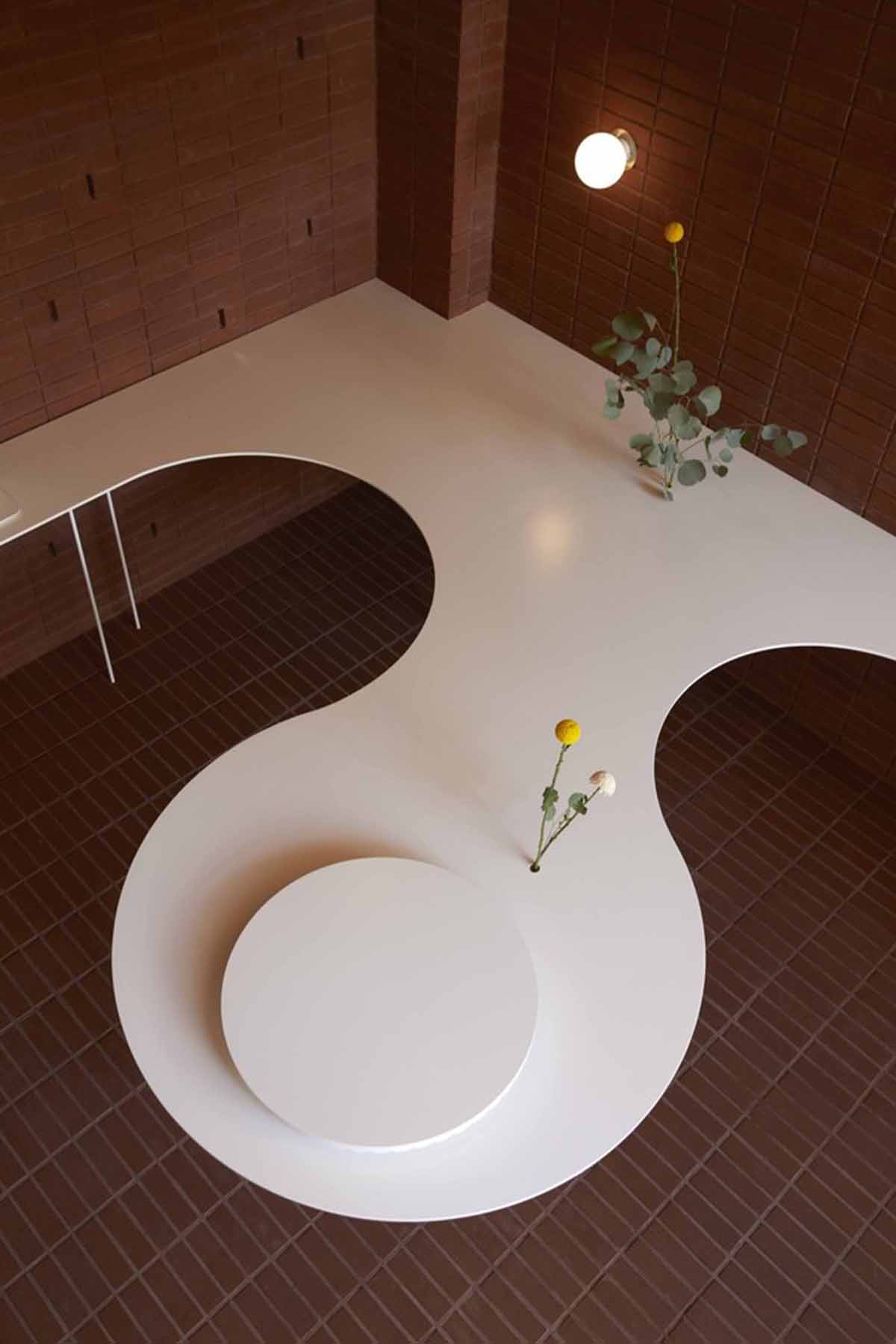 Roly-Poly Cotto restaurant fills in between historic buildings with its cave-like red brick facade