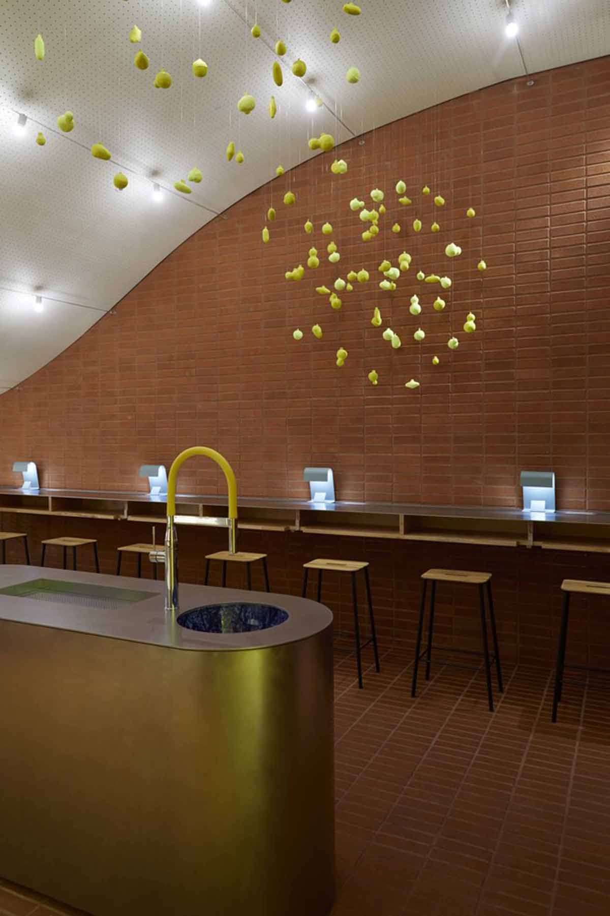 Roly-Poly Cotto restaurant fills in between historic buildings with its cave-like red brick facade