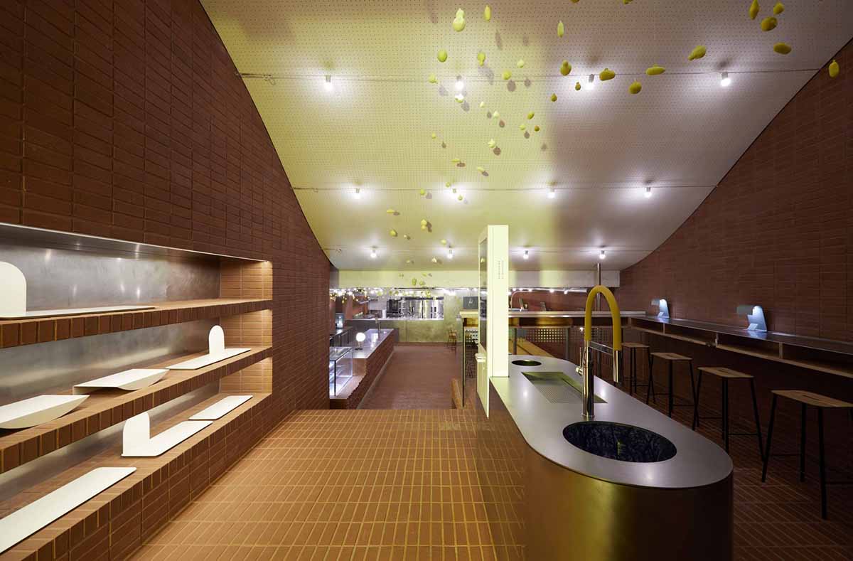 Roly-Poly Cotto restaurant fills in between historic buildings with its cave-like red brick facade