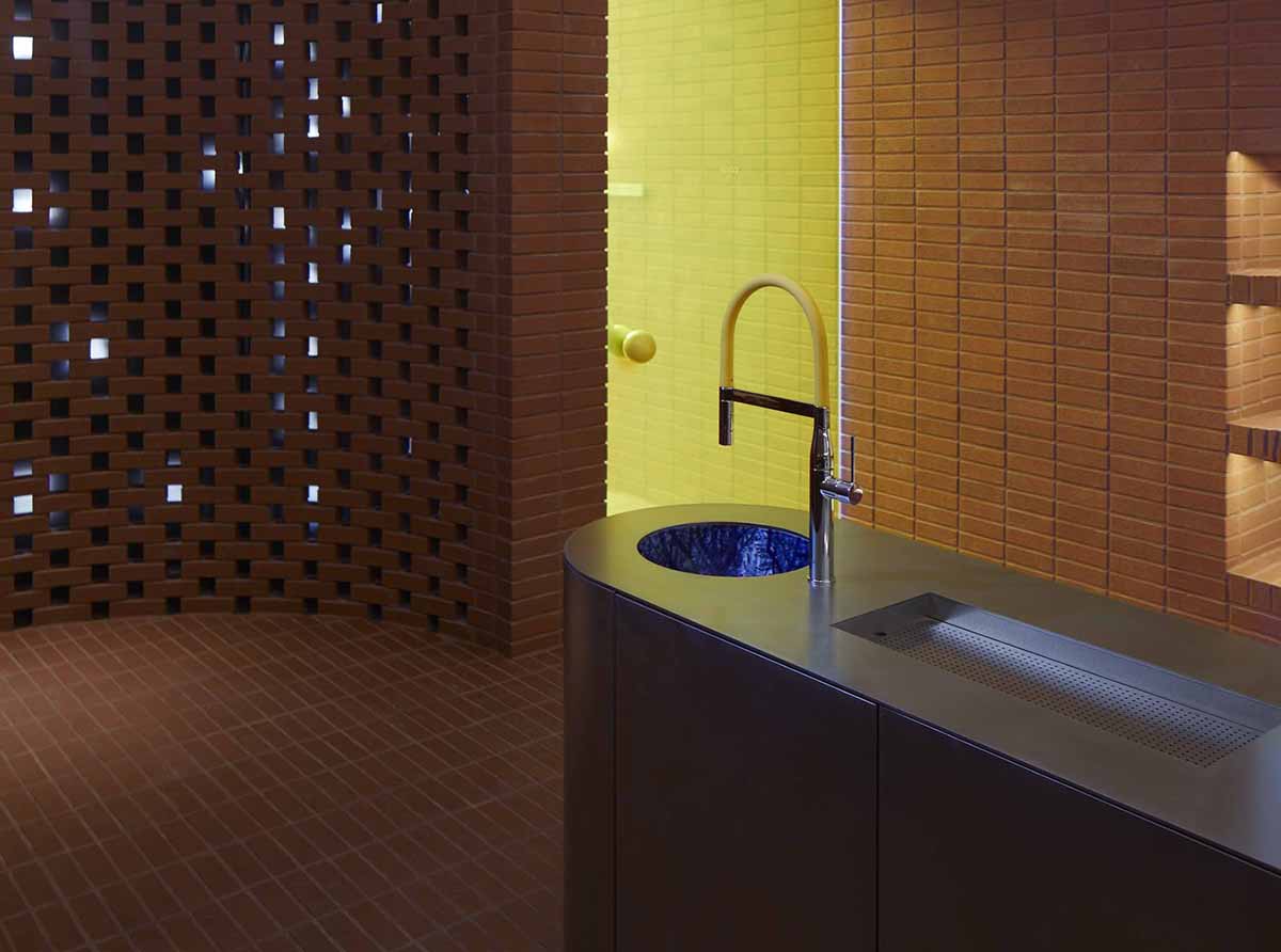 Roly-Poly Cotto restaurant fills in between historic buildings with its cave-like red brick facade