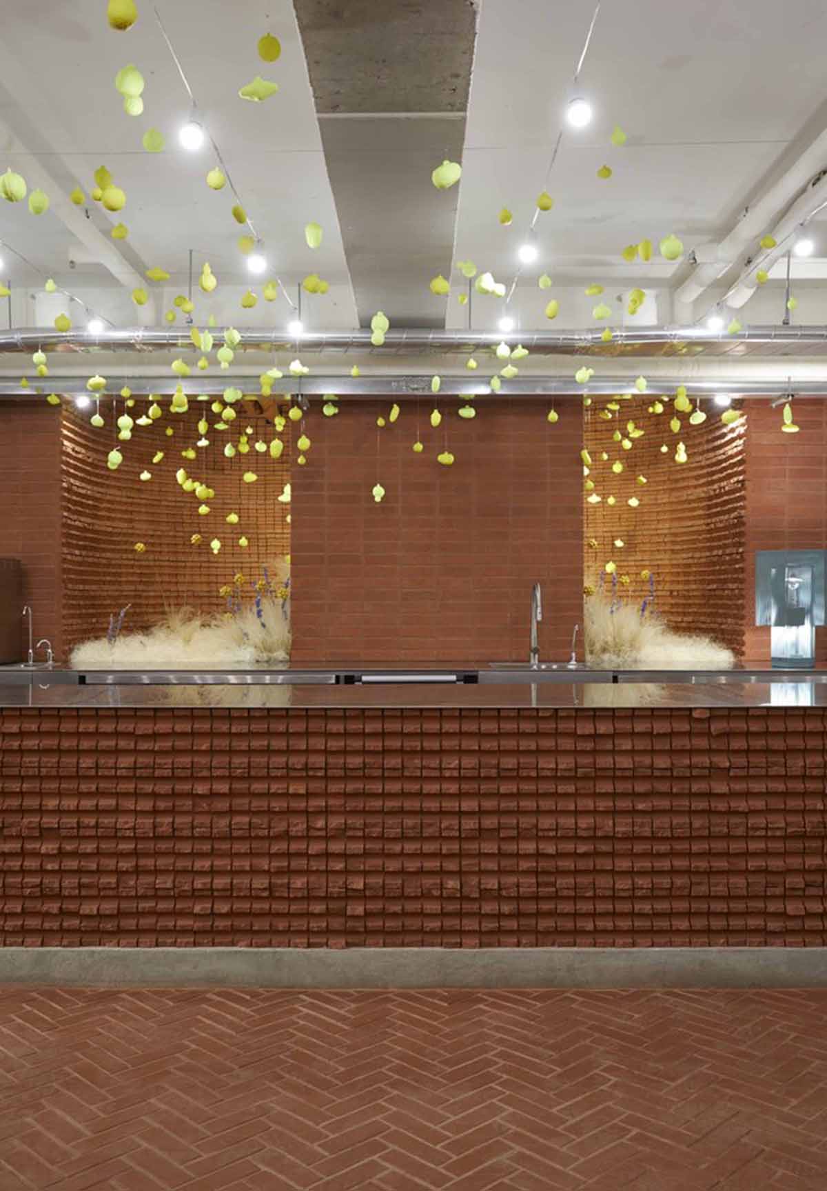 Roly-Poly Cotto restaurant fills in between historic buildings with its cave-like red brick facade