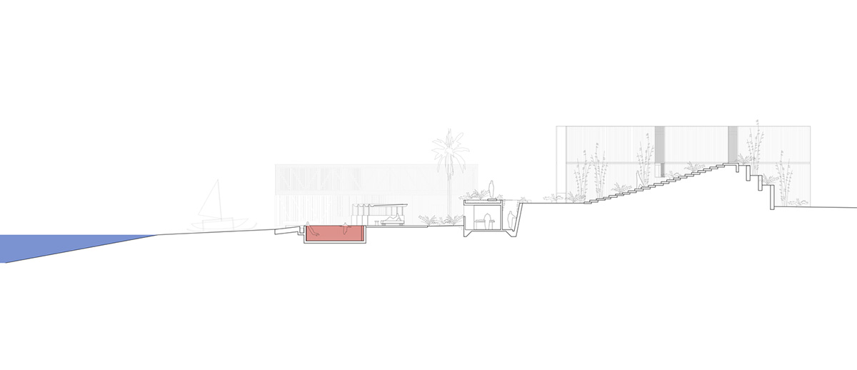 Linear concrete walls hide hotel rooms overlooking lush forest on the northern coast of Bali