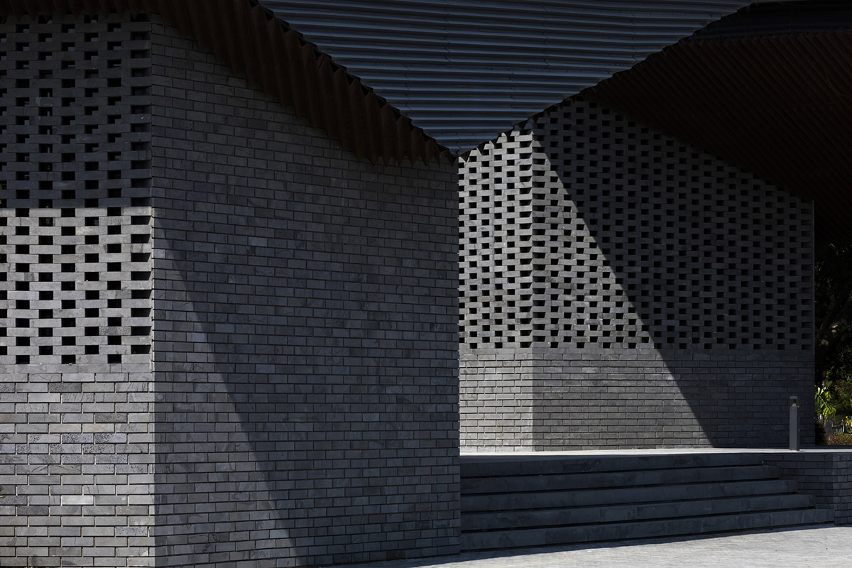 Hexagonal pavilions are hidden under V-shaped roofs that look like a pair of bird wings in Vietnam