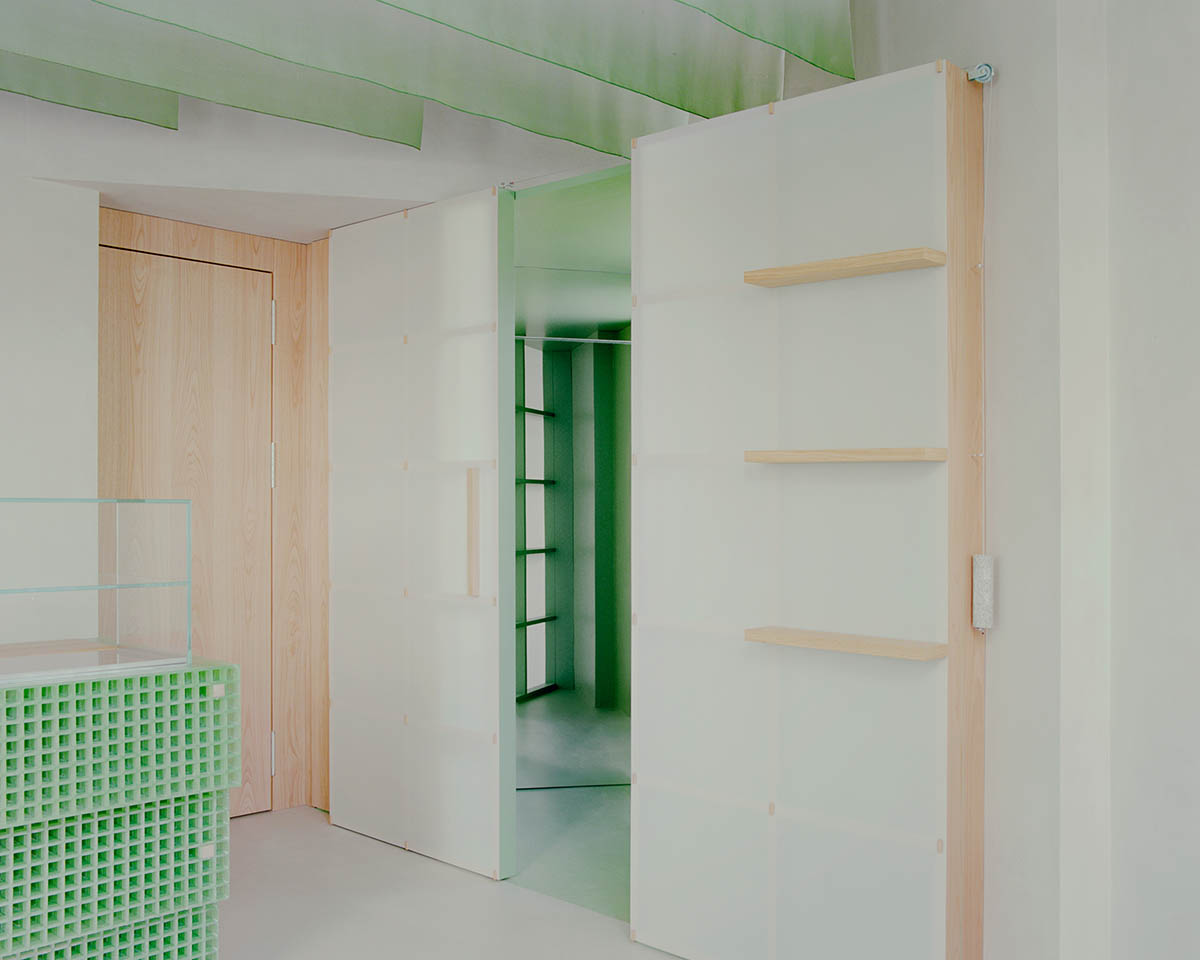 studio wok adds soft green tones and powder colors to interiors of a bakery in Milan 