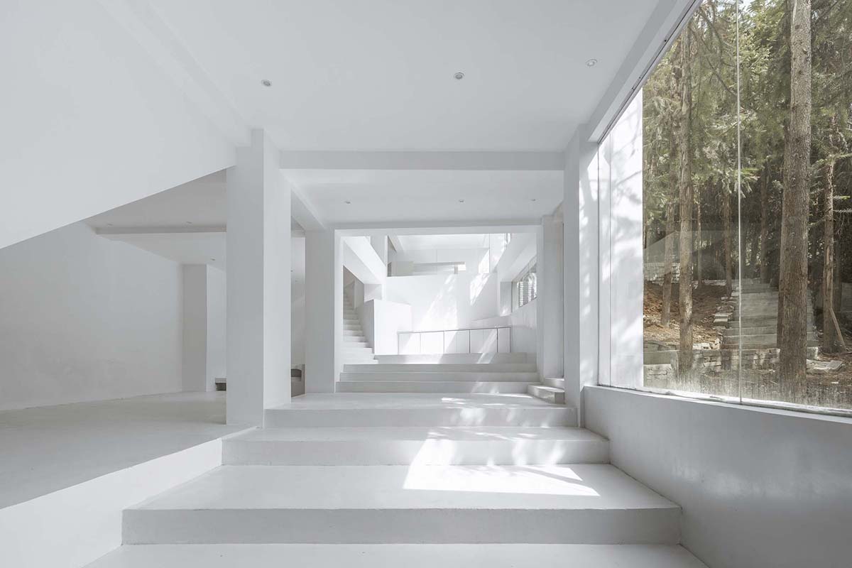 STUDIO QI reinterprets sequence of living conditions with tilted hotel on a hilly plot in China