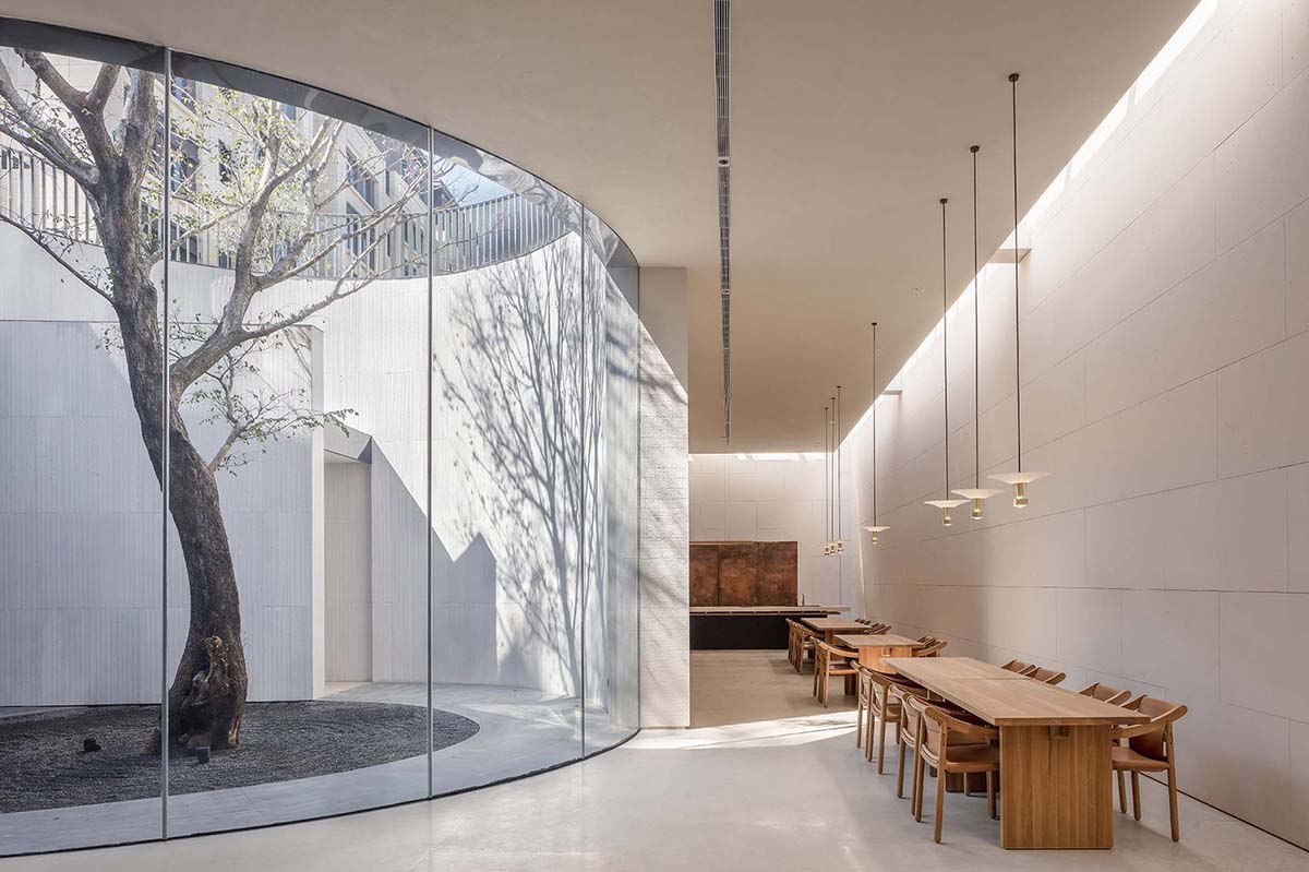 Waterfrom Design creates peaceful interior with wooden furnitures for tea community center in China