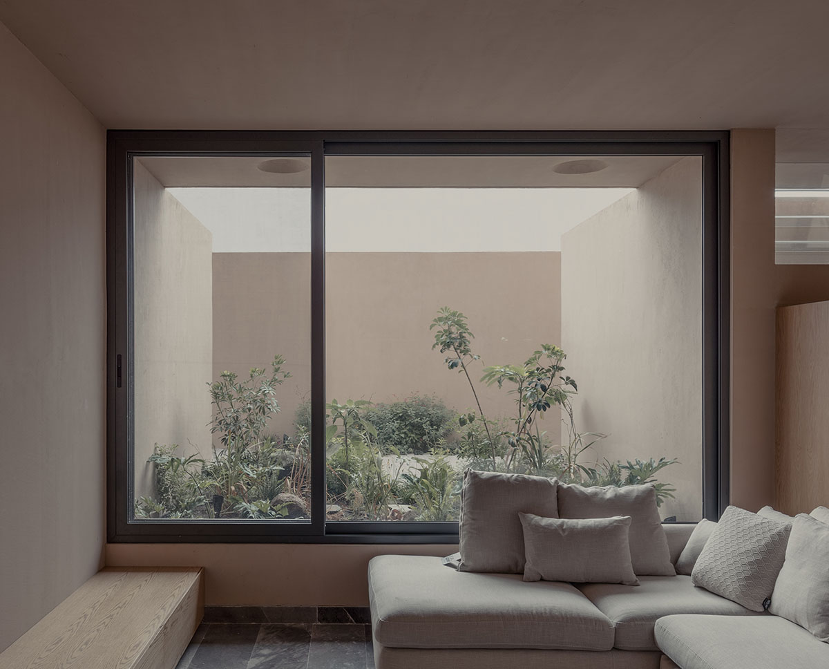 Taller Segovia Molina enriches beige Casa Aguilar with interior patios and an abundance of light