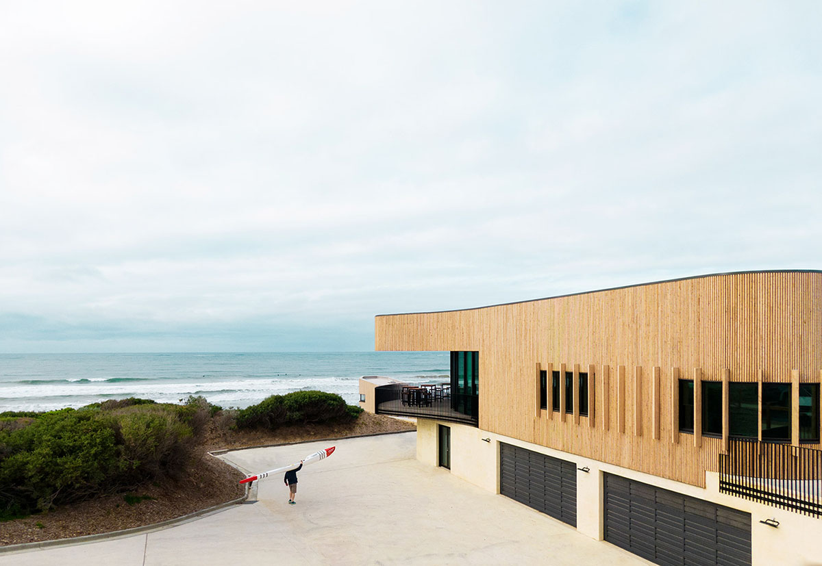 Wood Marsh completes surf club with timber rounded corners echoing ocean and eroded dunes