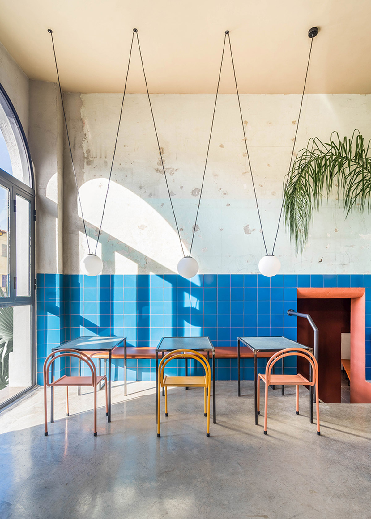 STUDIOTAMAT converts abandoned bakery into a colorful restaurant in Rome