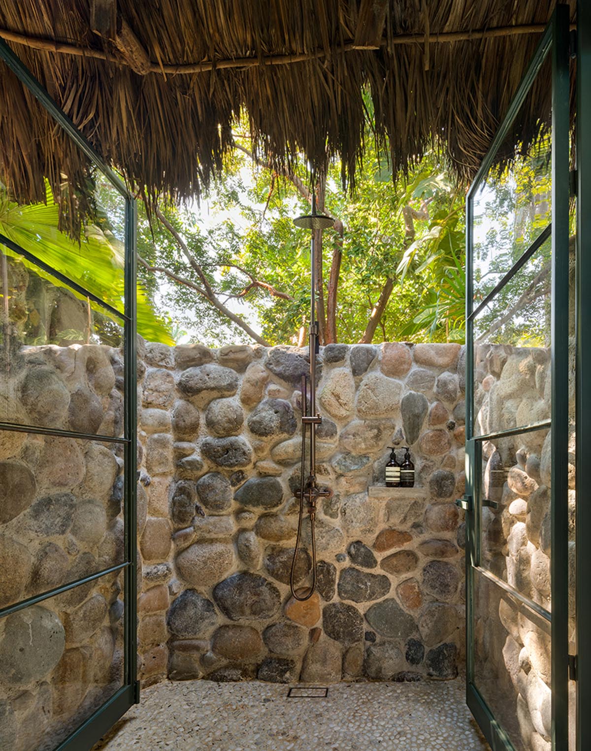 MAIN OFFICE adds half-circle yoga platform to thatched-roof guest villas in Sayulita, Mexico