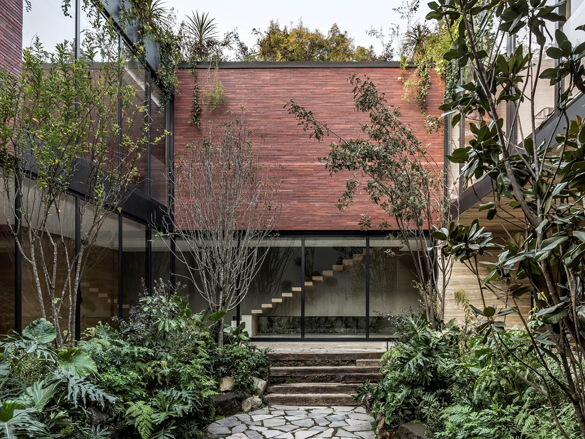 ESRAWE designs house by using red brick pavilion-like volumes in Mexico City