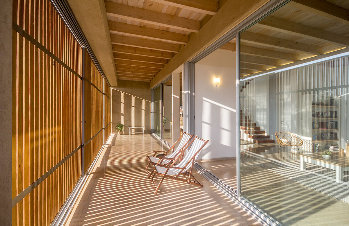 Golany Architects completes concrete private residence with wooden shutters in the Galilee