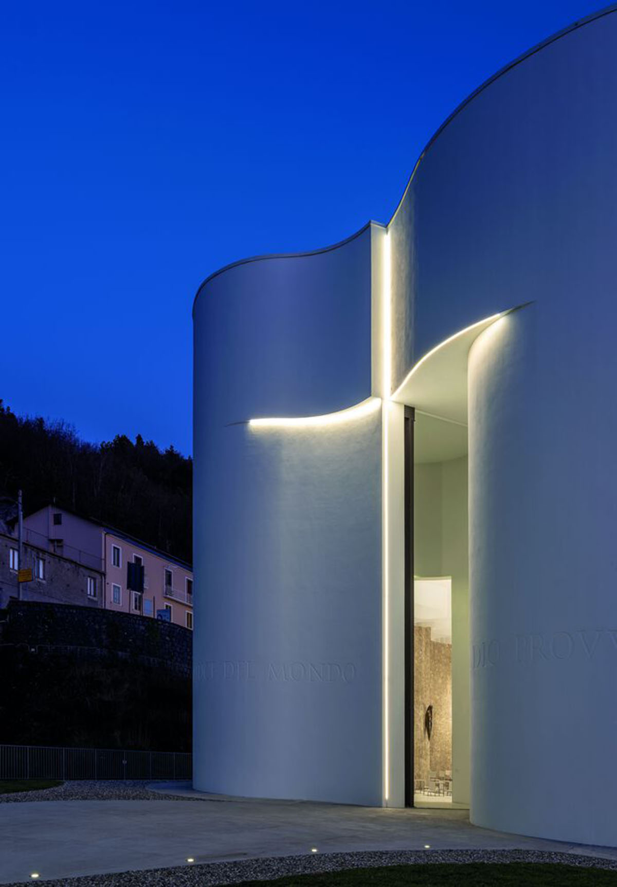 Smooth all-white walls form church designed by Mario Cucinella Architects in Mormanno hill town 