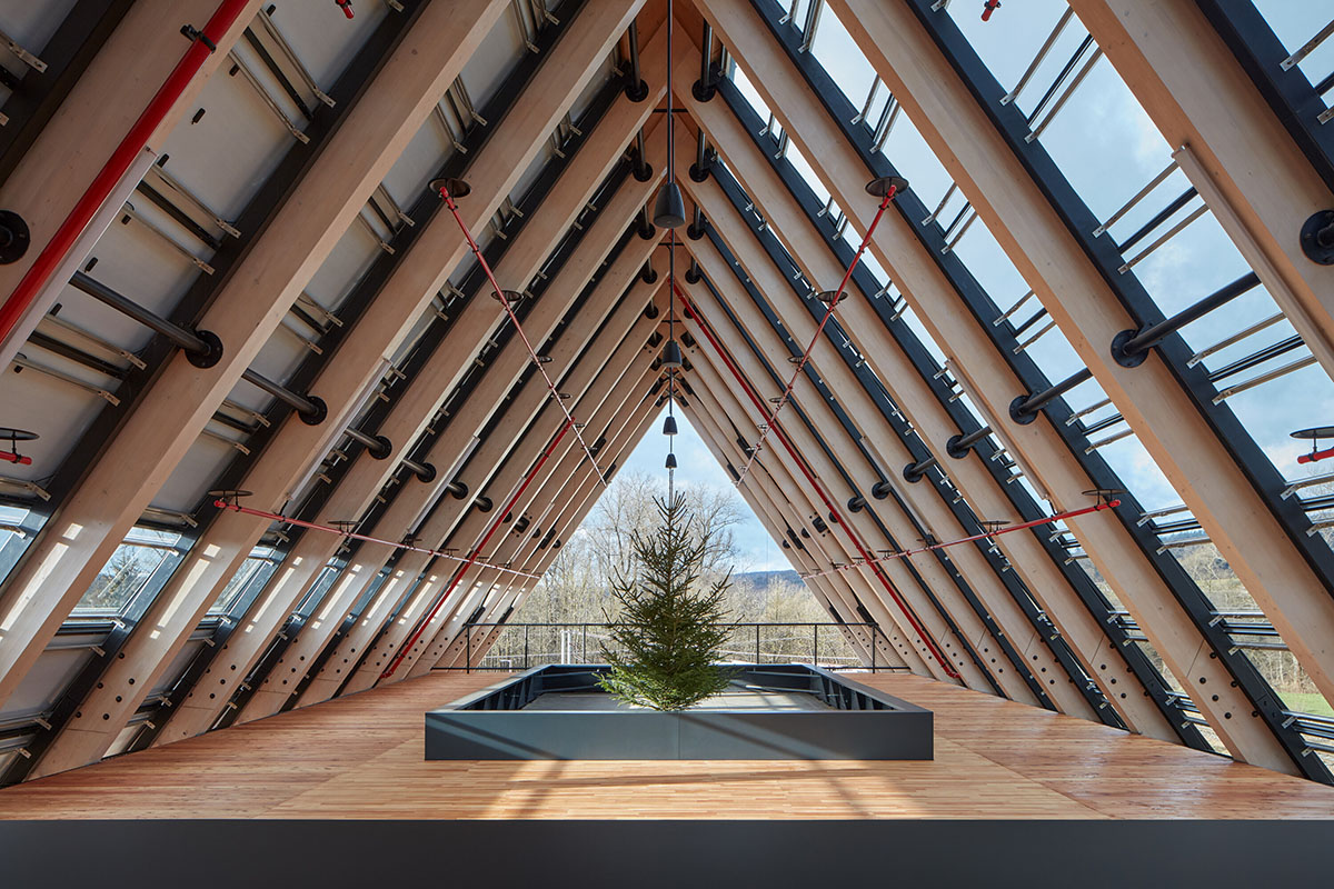 Mjölk Architekti completes gabled roof wooden headquarters addressing sustainable construction 