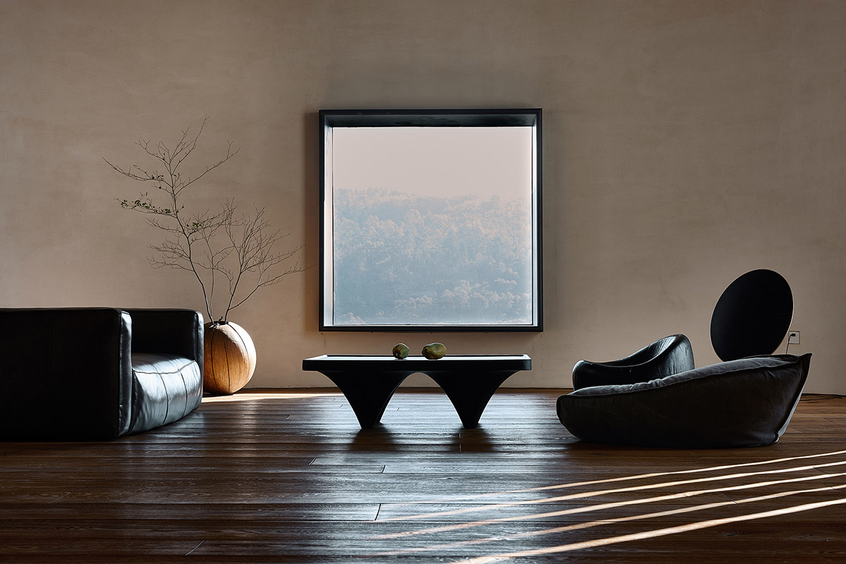 ZMY Design creates earth-toned interiors for a woodwork enthusiast’s house in Fujian, China