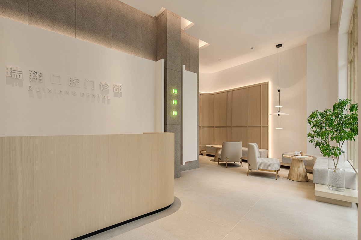 JACKY.W DESIGN completes dental clinic with rounded wooden walls and natural tones in China 