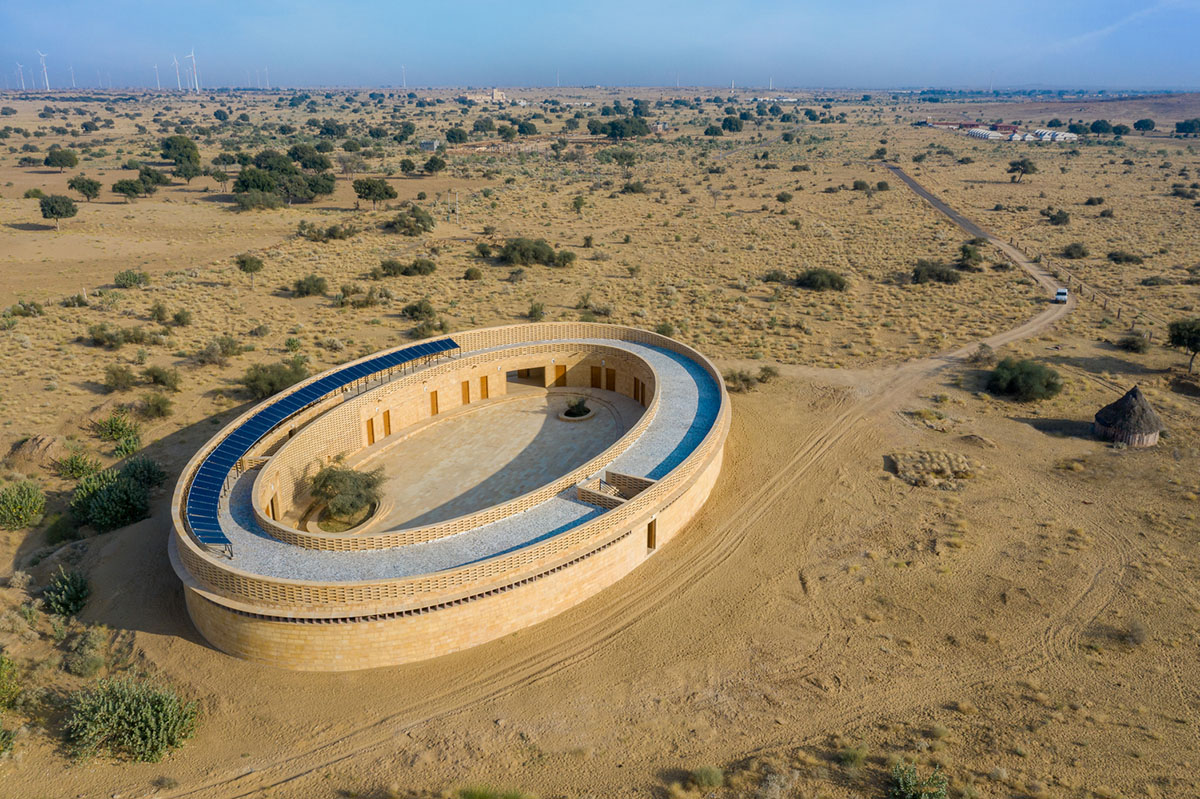 Diana Kellogg Architects' oval-shaped girl's school is made of hand-carved sandstone in rural India