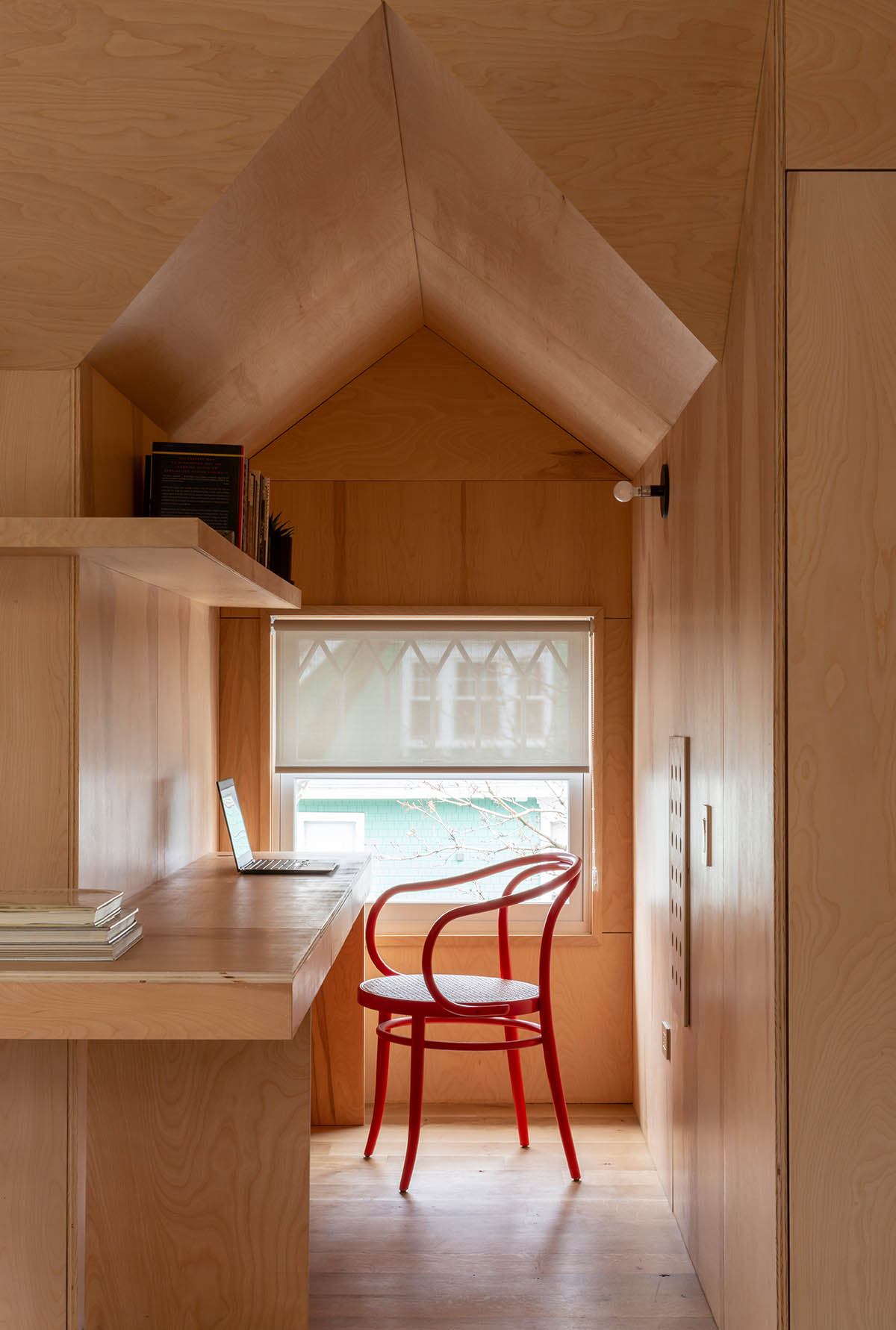 An attic for Ditmas House features colorful interiors designed by Shakespeare Gordon Studio