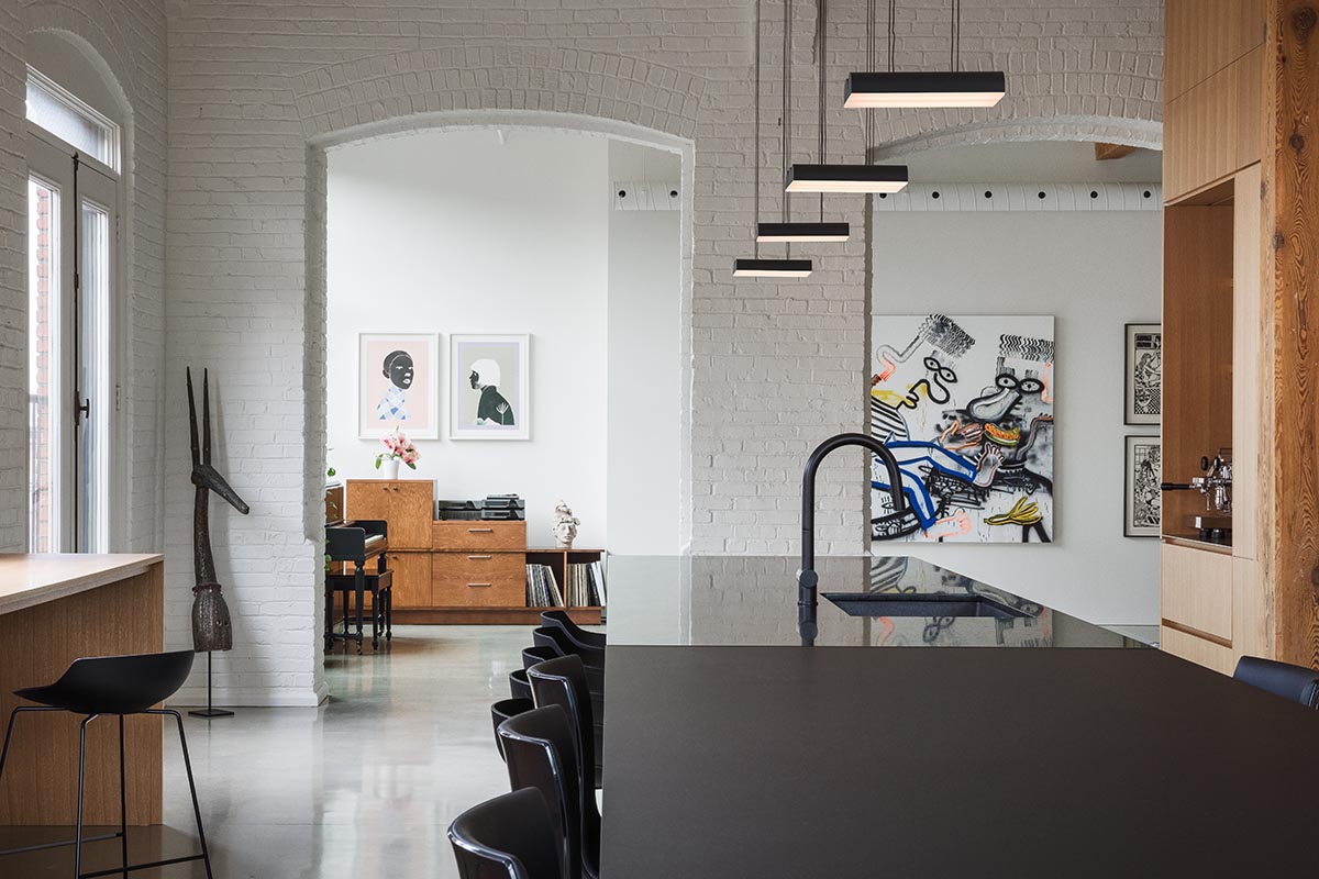 La Firme renovates historic mid-19th-century building with brick walls and oak cabinets in Montreal 