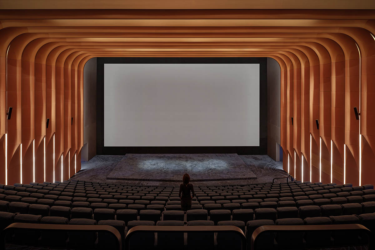 One Plus Partnership adds layered bricks to a cinema interior to resemble waves in Haikou