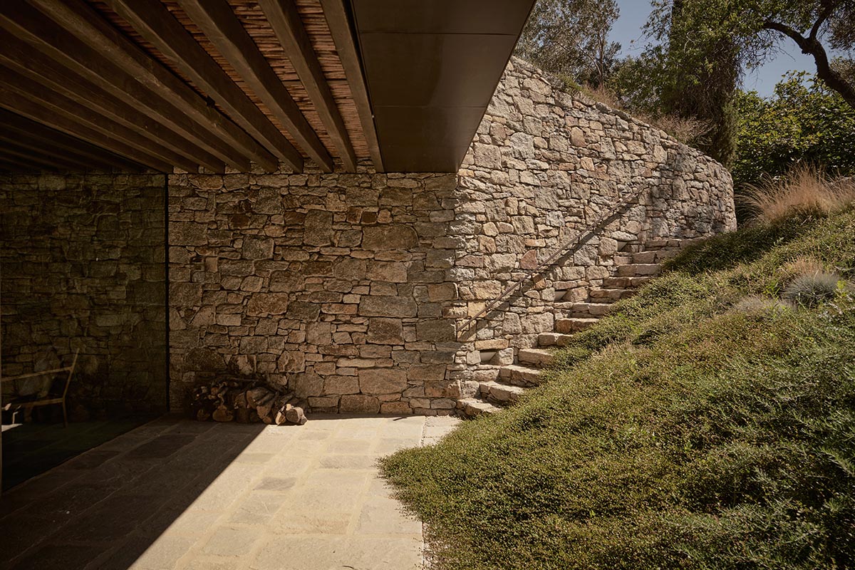 Terraced stonewalls sprawl down to offer an exploratory route in an old vineyard in Samos