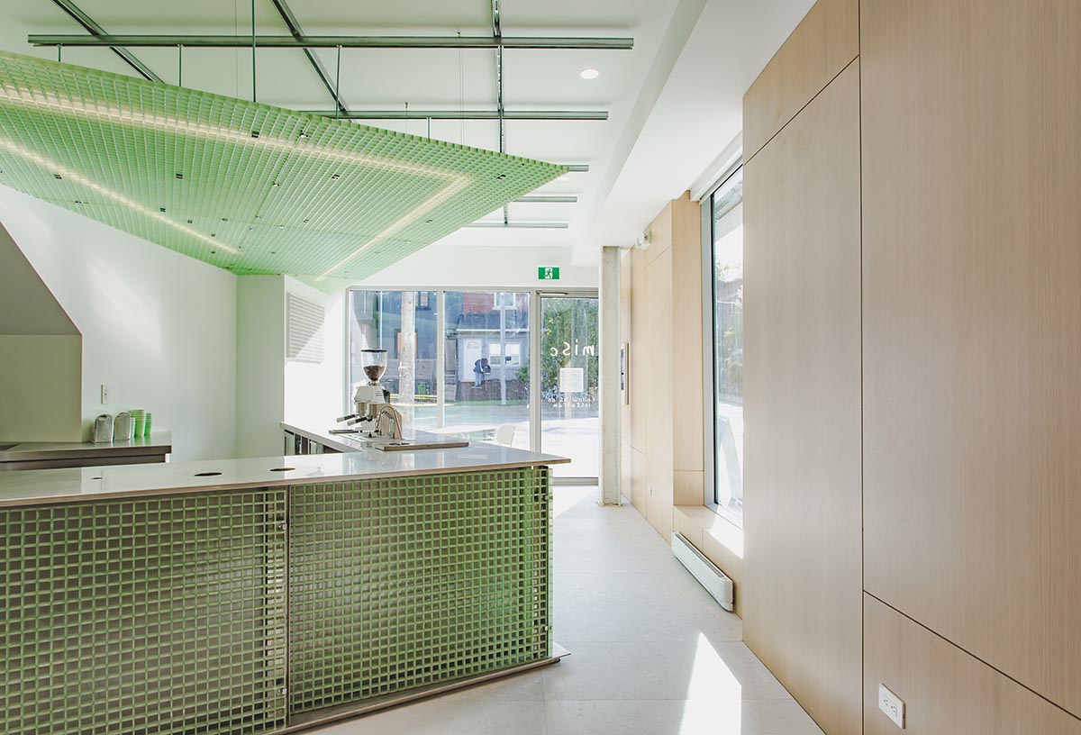 Misc Coffee makes a bold statement with green translucent bar in a busy street of Toronto