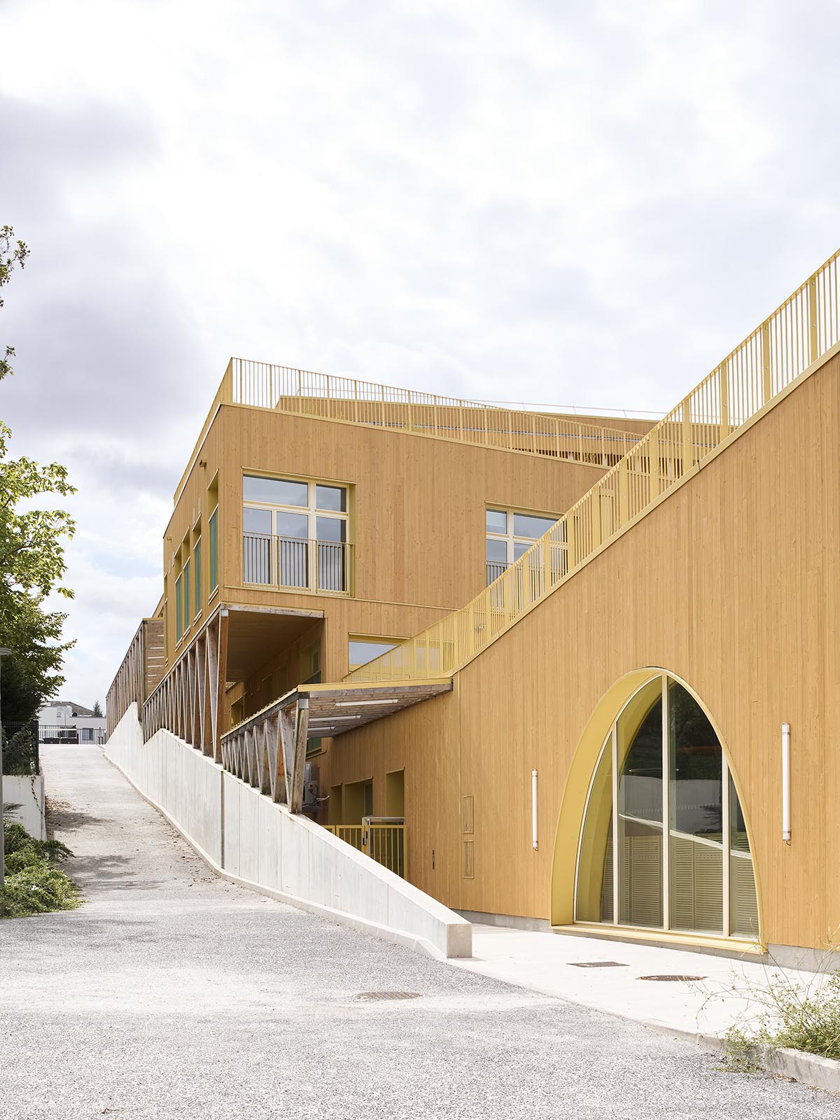 Wooden school by r2k architecte is inspired by Nordic architecture to be a positive energy building