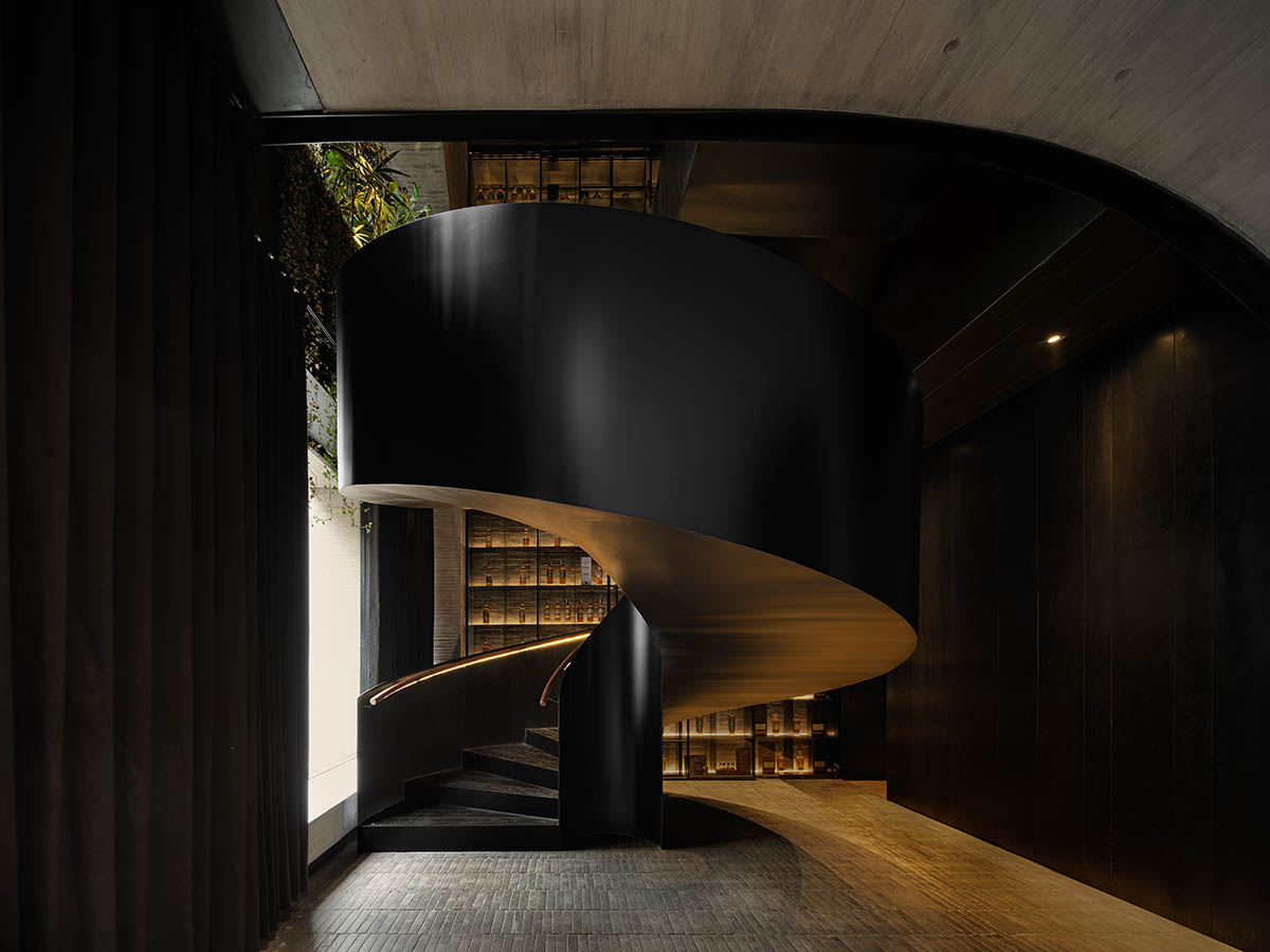 Large triple-arched windows enhance the iconic presence of the concrete Whisky Bar in Taiyuan, China