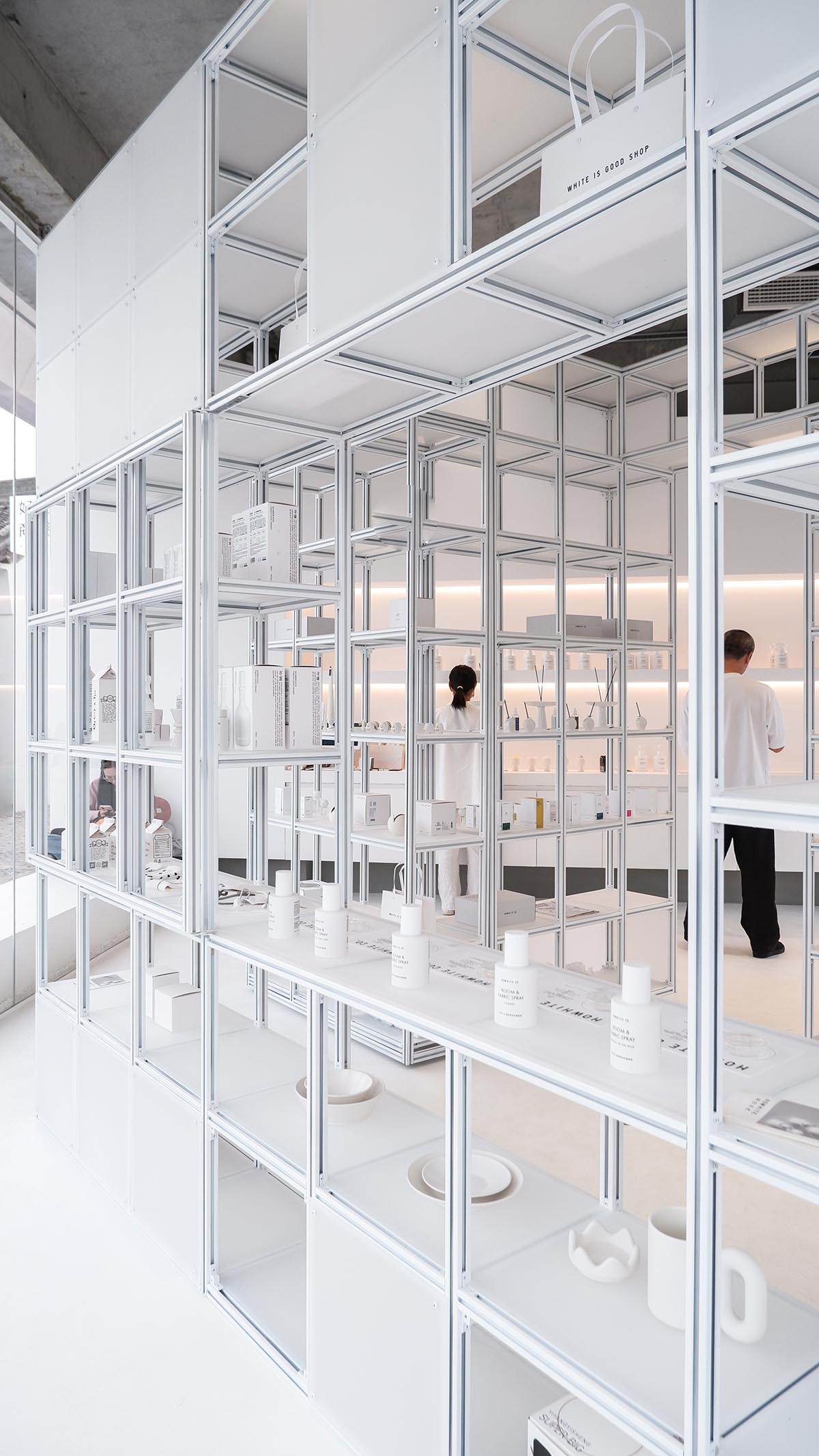 A shop is attached to Beijing historic Hutong houses with white-colored skin