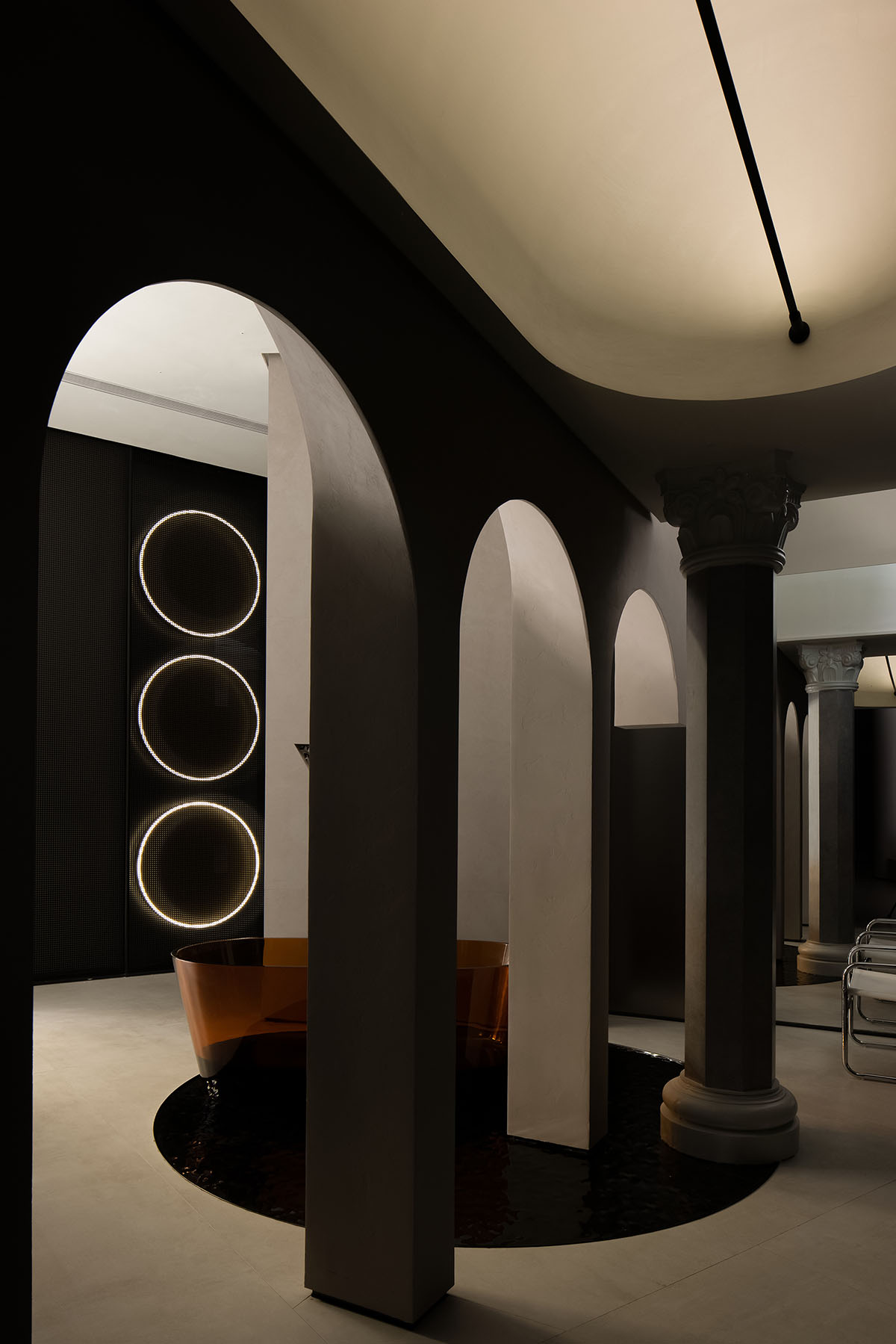 Curved walls and cave-like holes form I.T CERAMICHE Headquarters by Foshan Topway Design