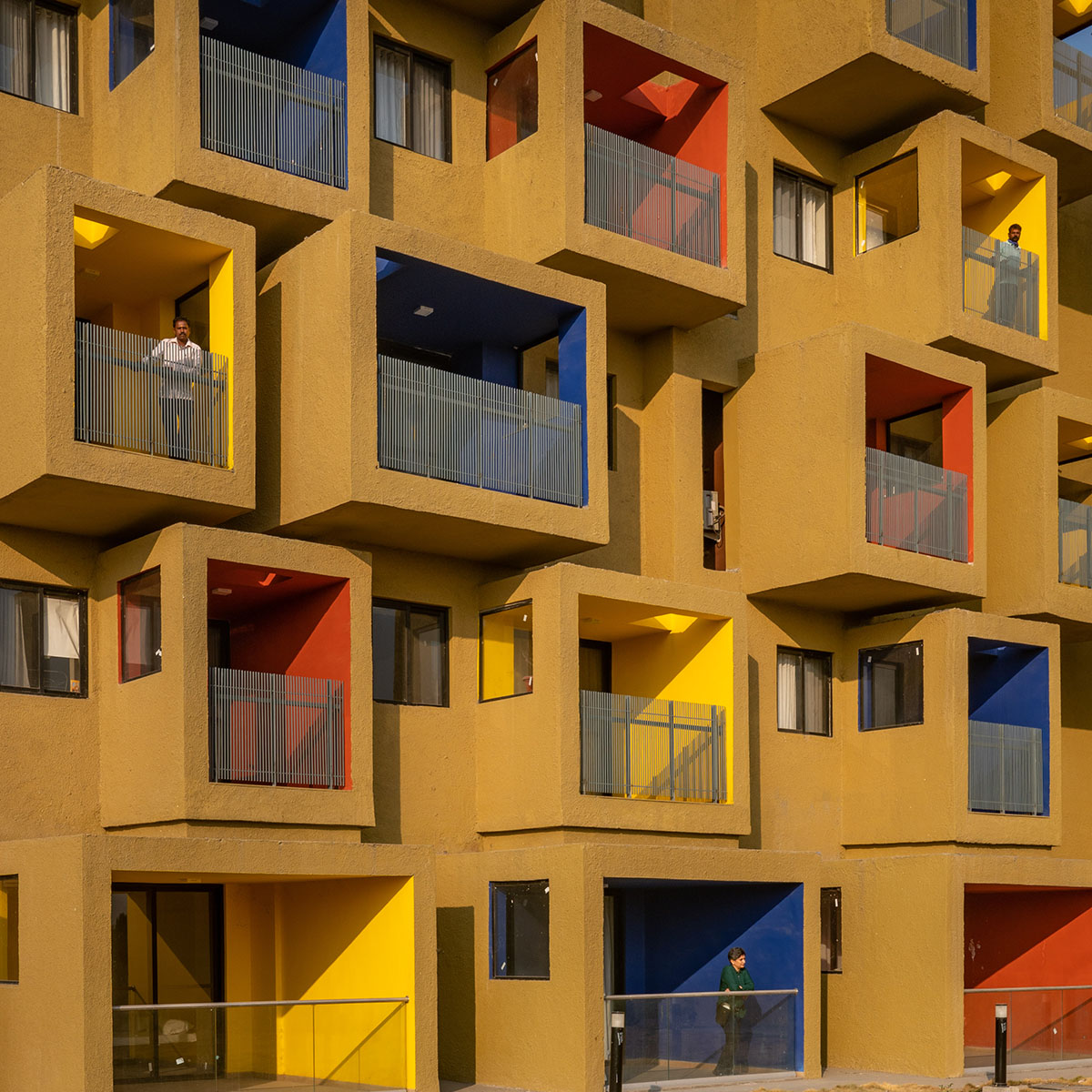 Sanjay Puri Architects designs residential building with colorful cuboid terraces in India