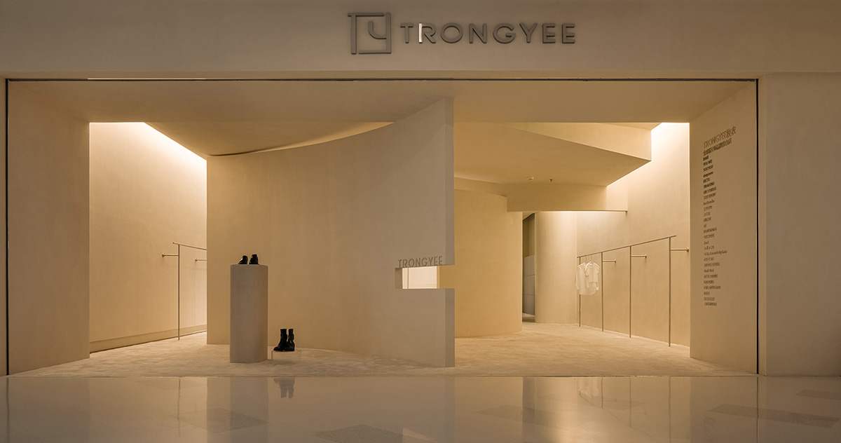 AD ARCHITECTURE designs store with light yellow curved walls that create comfort and softness 