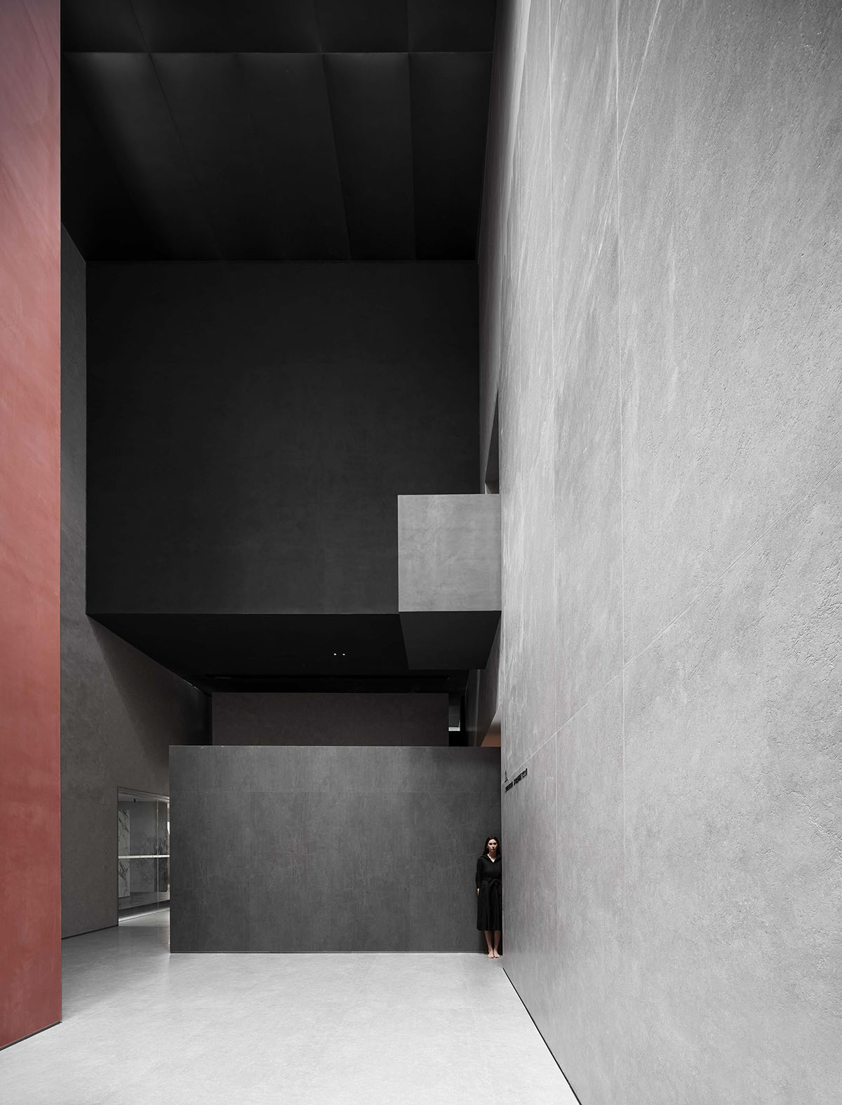 AD ARCHITECTURE creates dark interiors for showroom playing with light and sharp geometries in Foshan